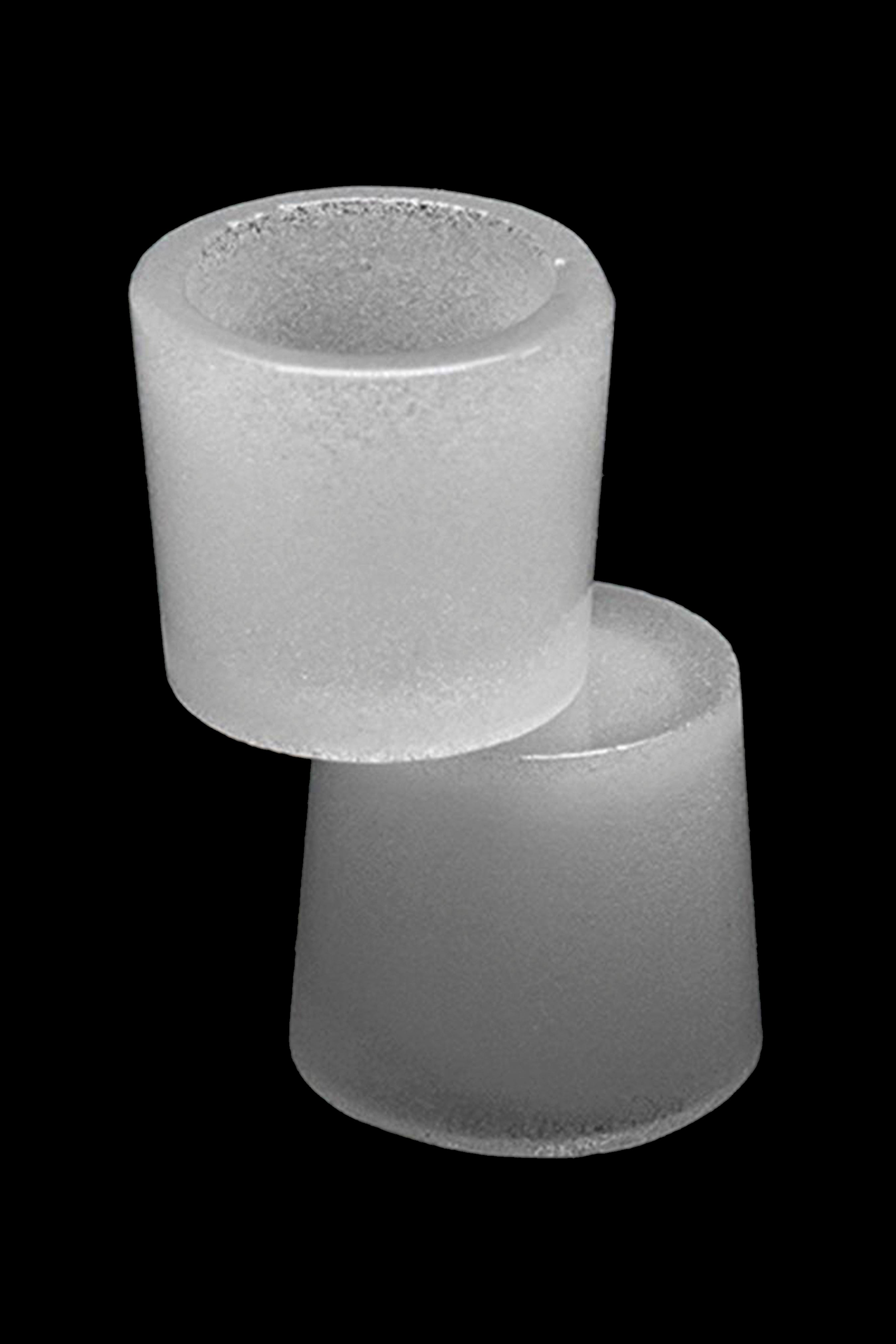 Frosted glass joint tips stacked on a black background.