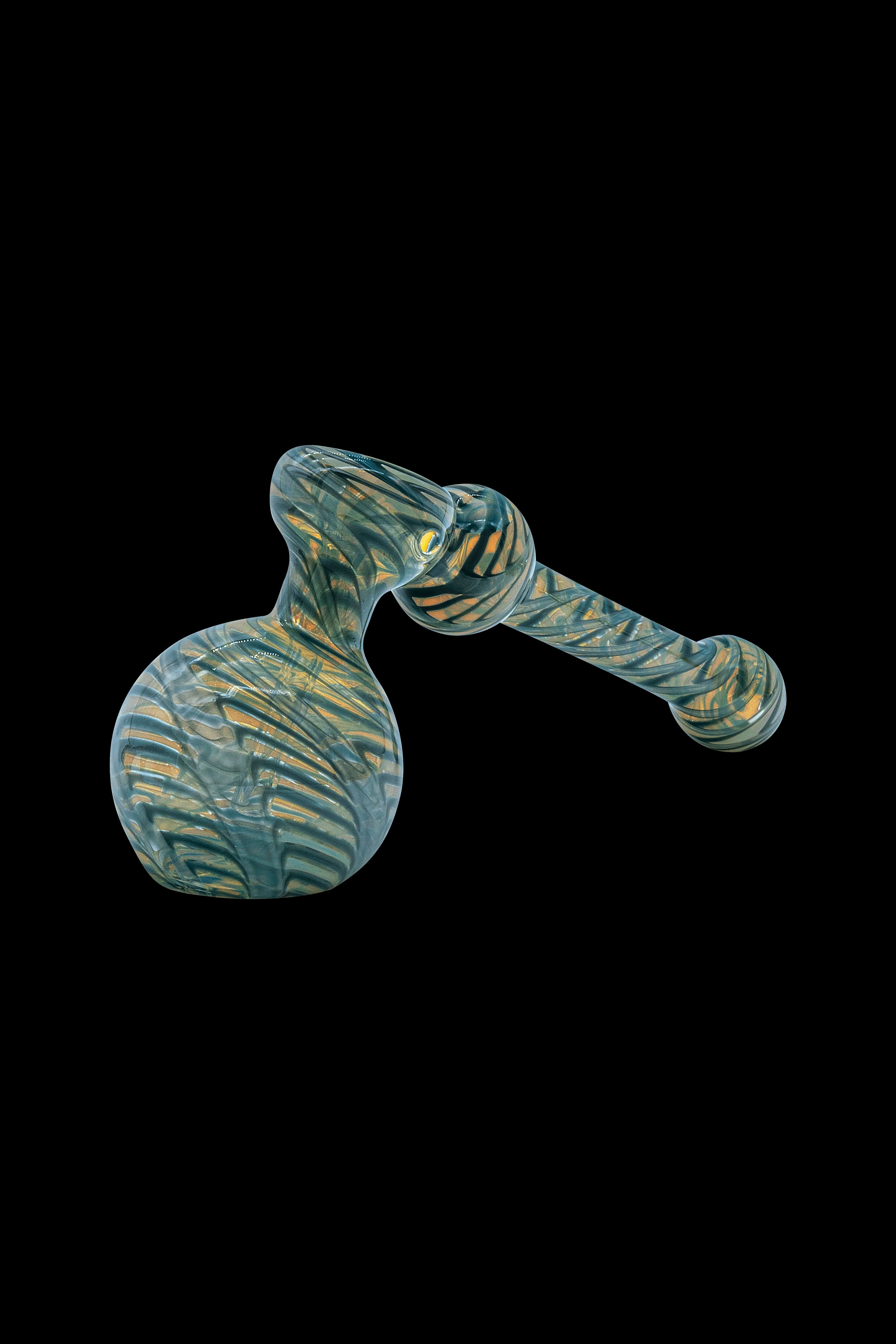 Green and gold glass bubbler pipe against a black background.