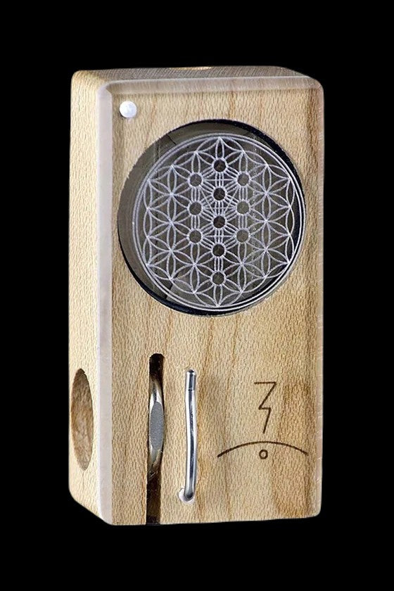 Wooden cannabis vaporizer with intricate circular design.