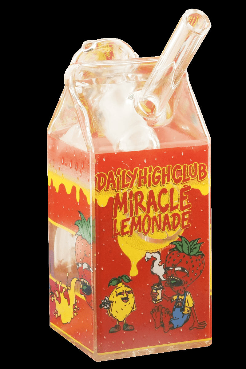 A glass water pipe shaped like a carton of "Daily High Club Miracle Lemonade," featuring cartoon illustrations of lemons and strawberries.