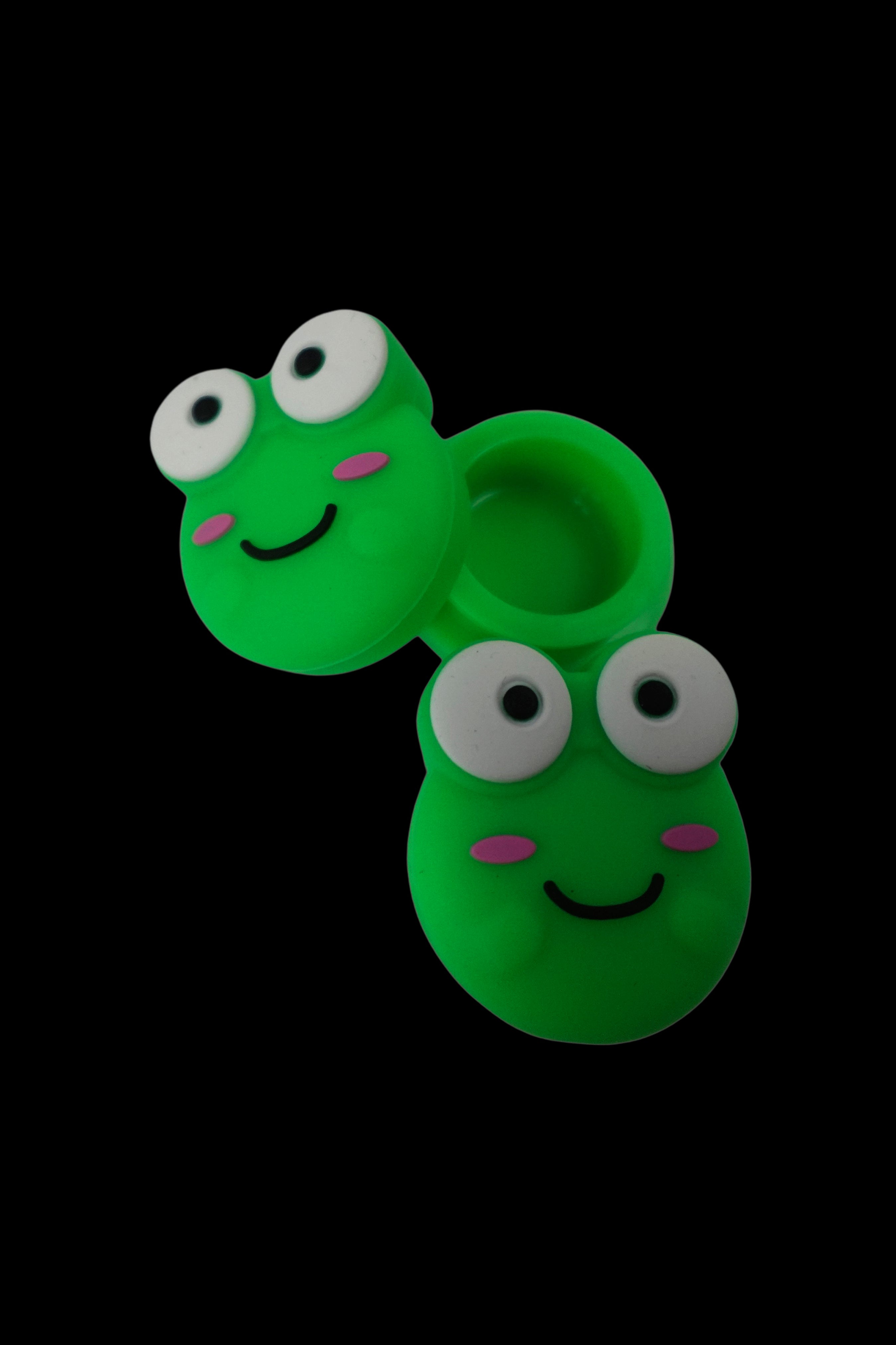 Two cartoon frog-shaped silicone smoking pipes against a black background.