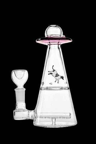 Clear glass water pipe shaped like a UFO with a cartoon cow illustration.