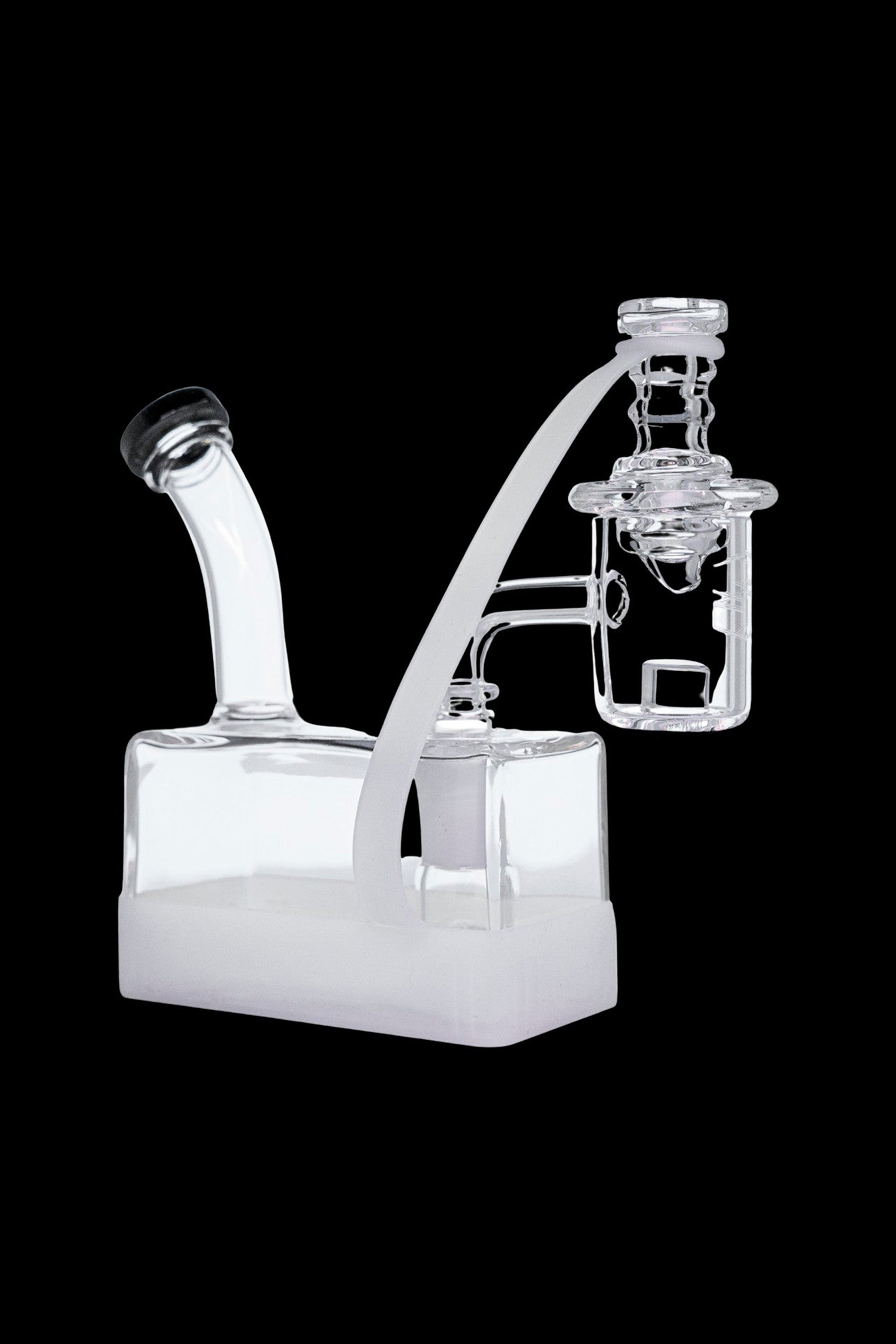 Clear glass dab rig with intricate bubbler and angled mouthpiece.