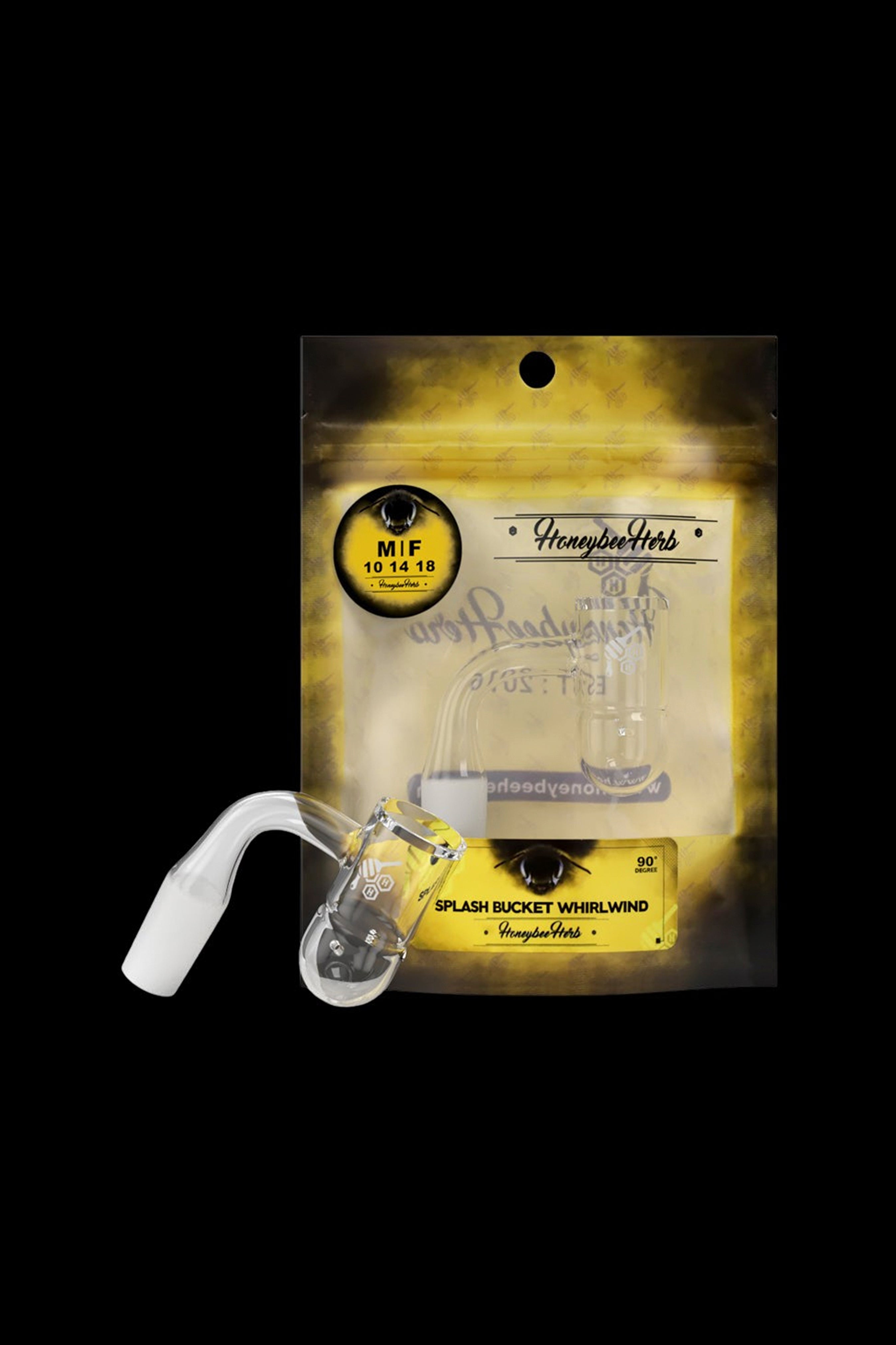 A glass cannabis water pipe, labeled “Splash Bucket Whirlwind” by Honeybee Herbs, sealed in a clear plastic bag.
