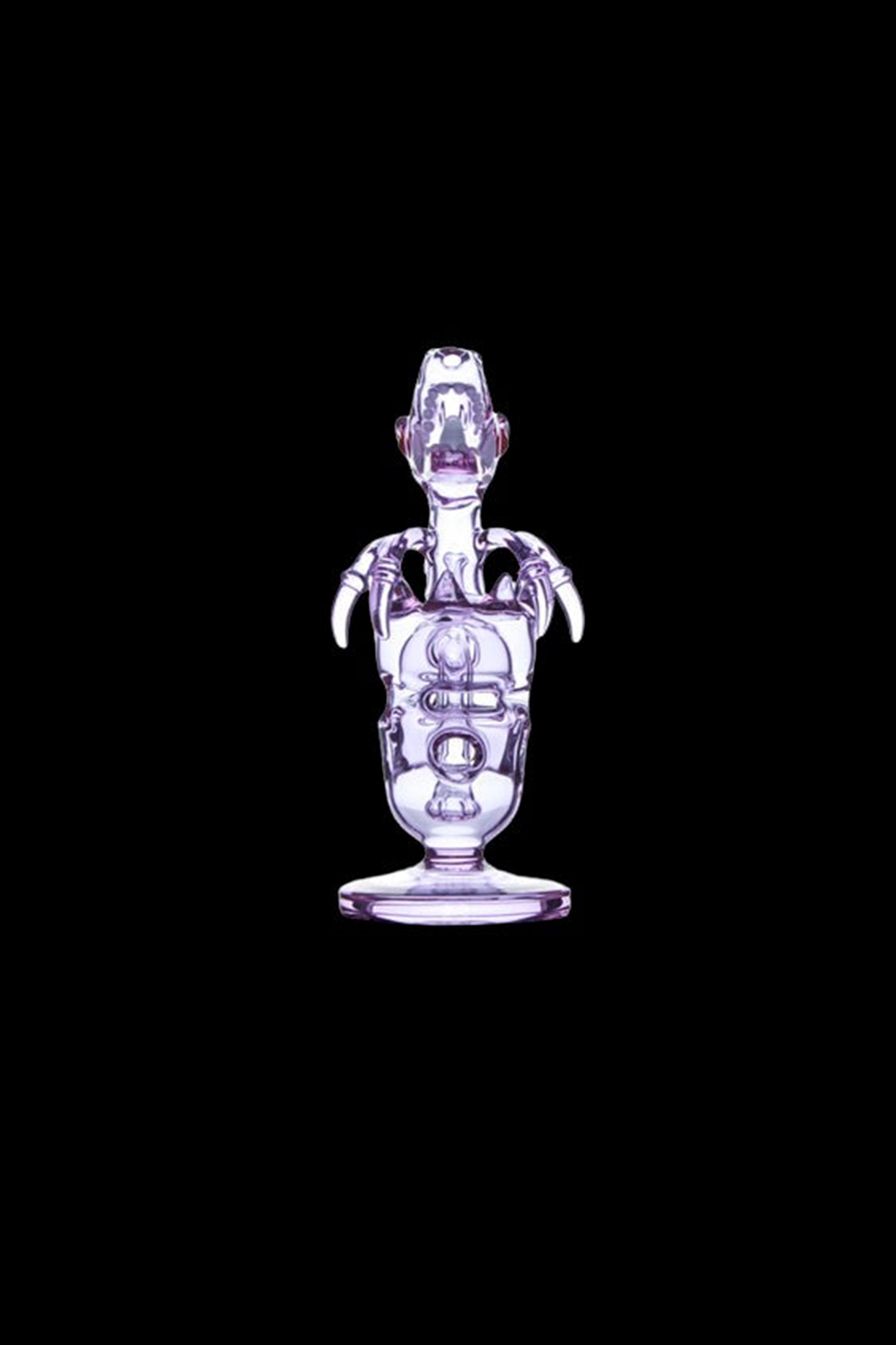 Center-frontal view of the purple Calibear Fab Dino Rig on a black background, showing its dinosaur-shaped glass body and claw-like arms.