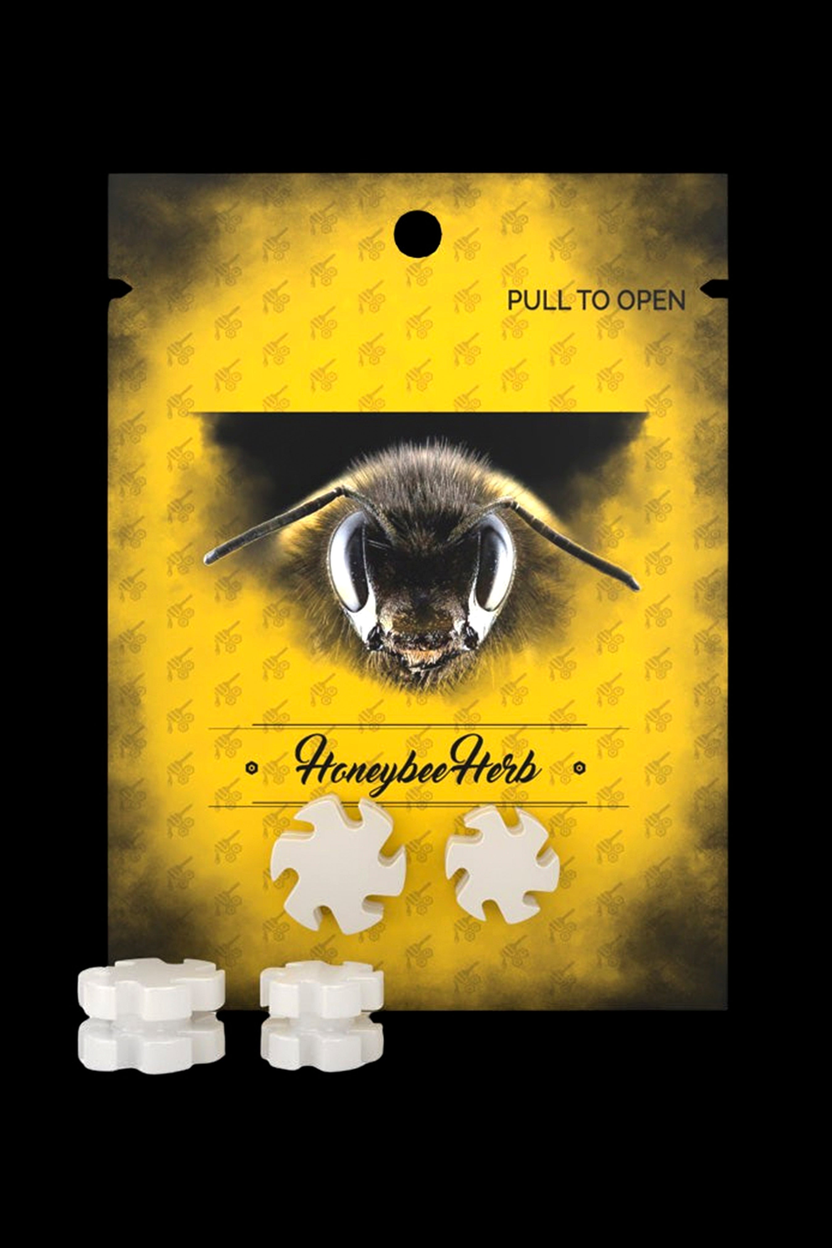 Yellow cannabis packaging bag featuring a bee illustration and text "Honeybee Herb" with tear-off access pieces.