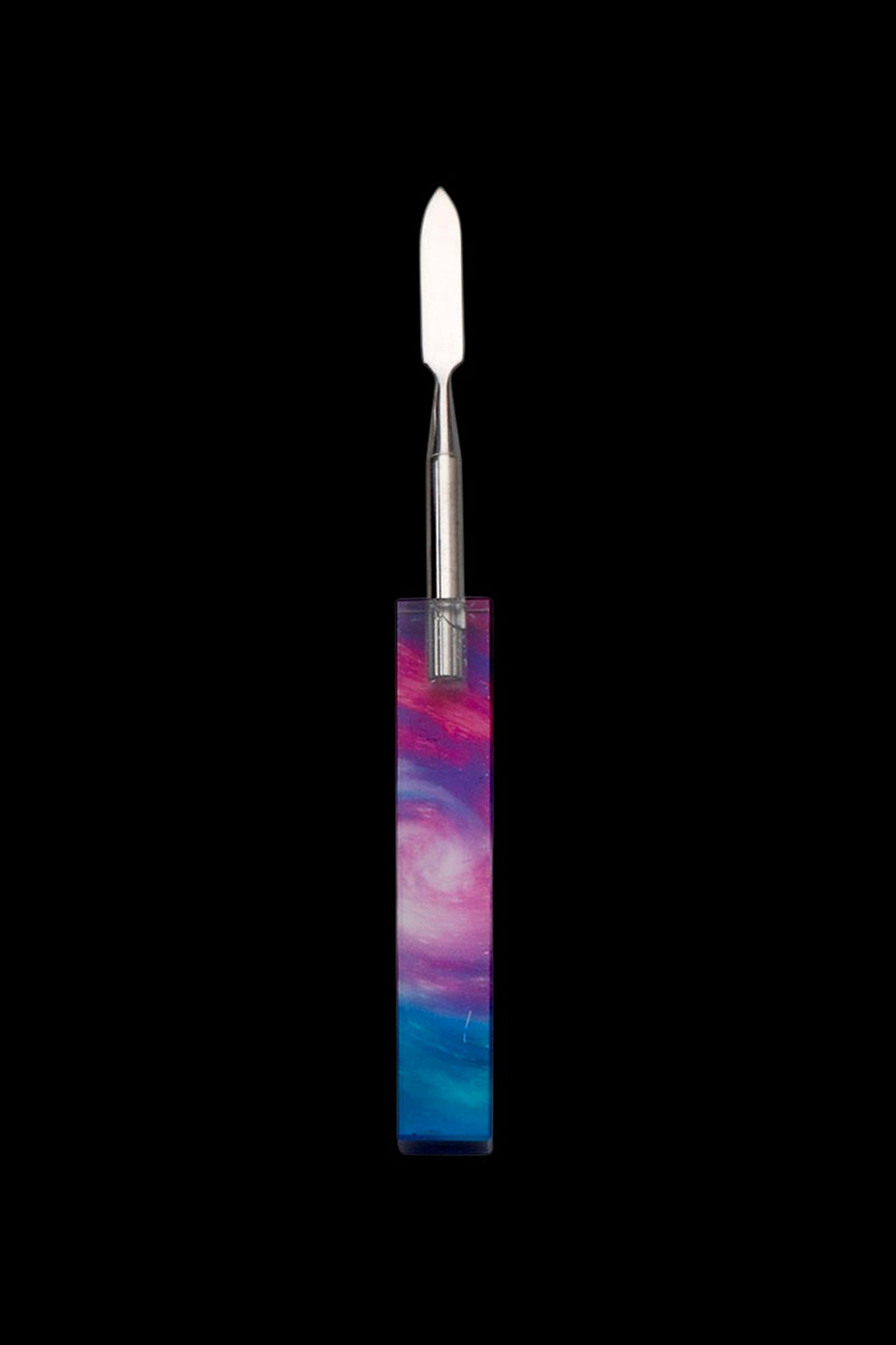 Colorful glass dab tool with a metal tip.