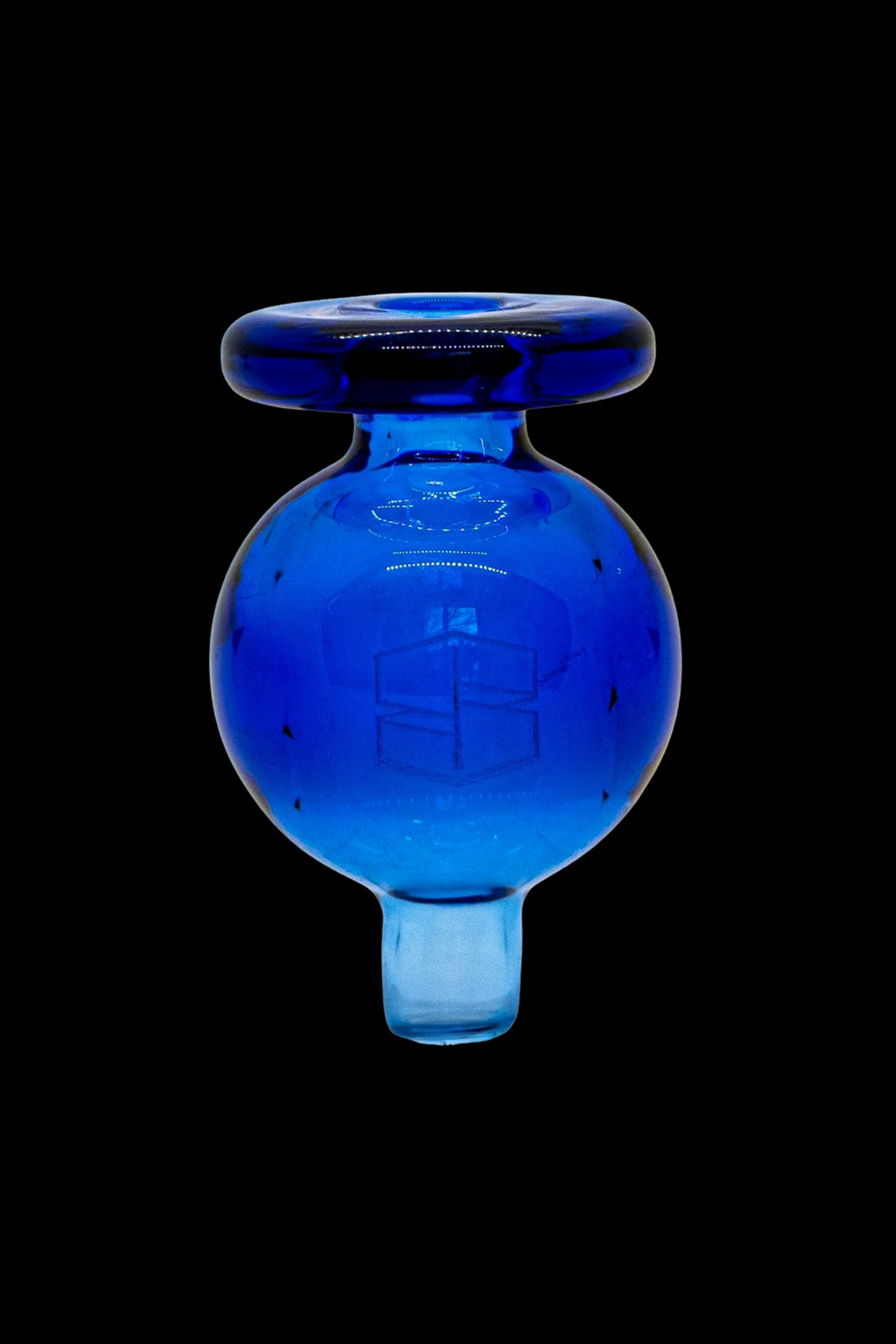 Blue glass cannabis oil dome with carb cap.