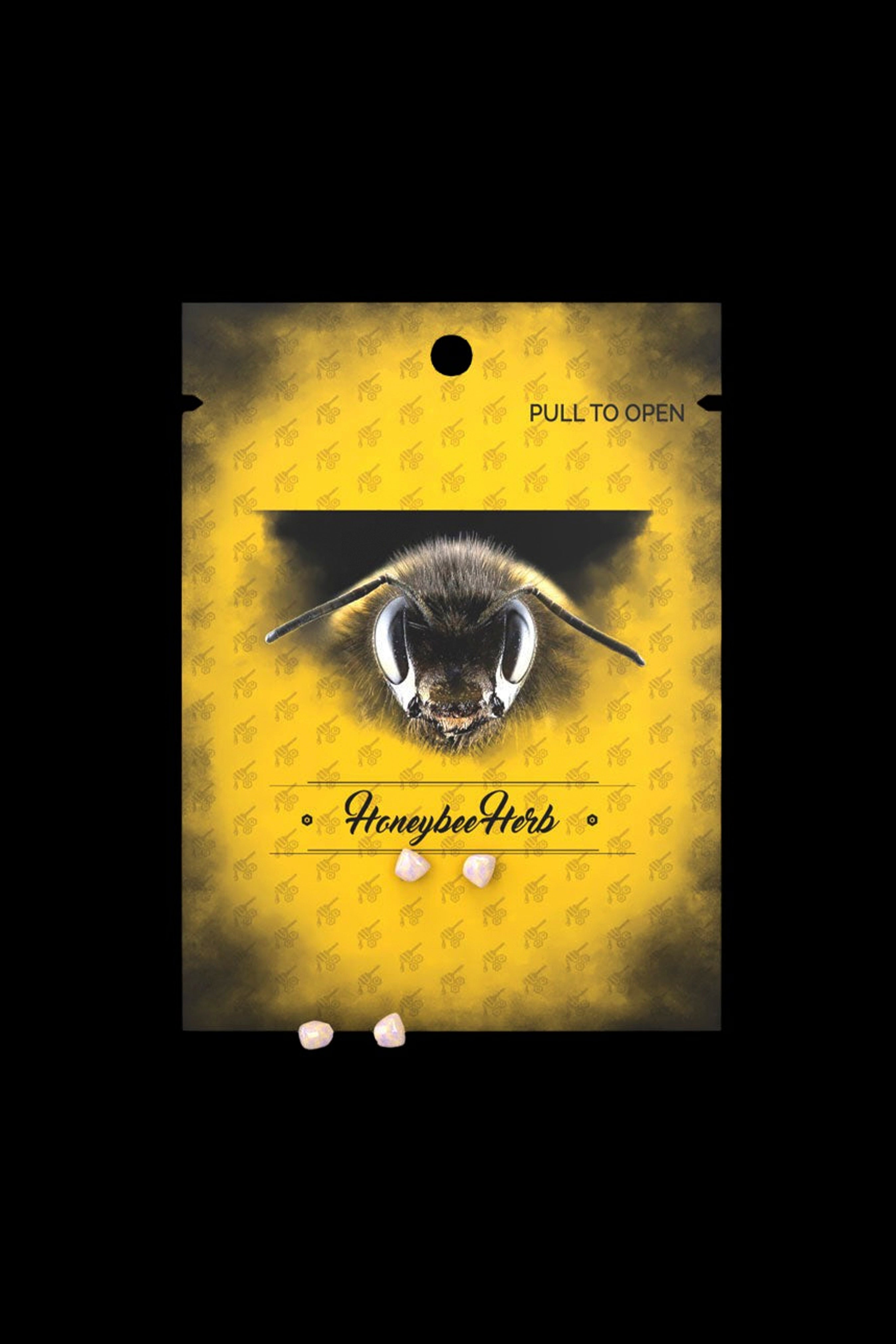 Yellow pouch labeled “Honeybee Herbs” displaying cannabis edibles.