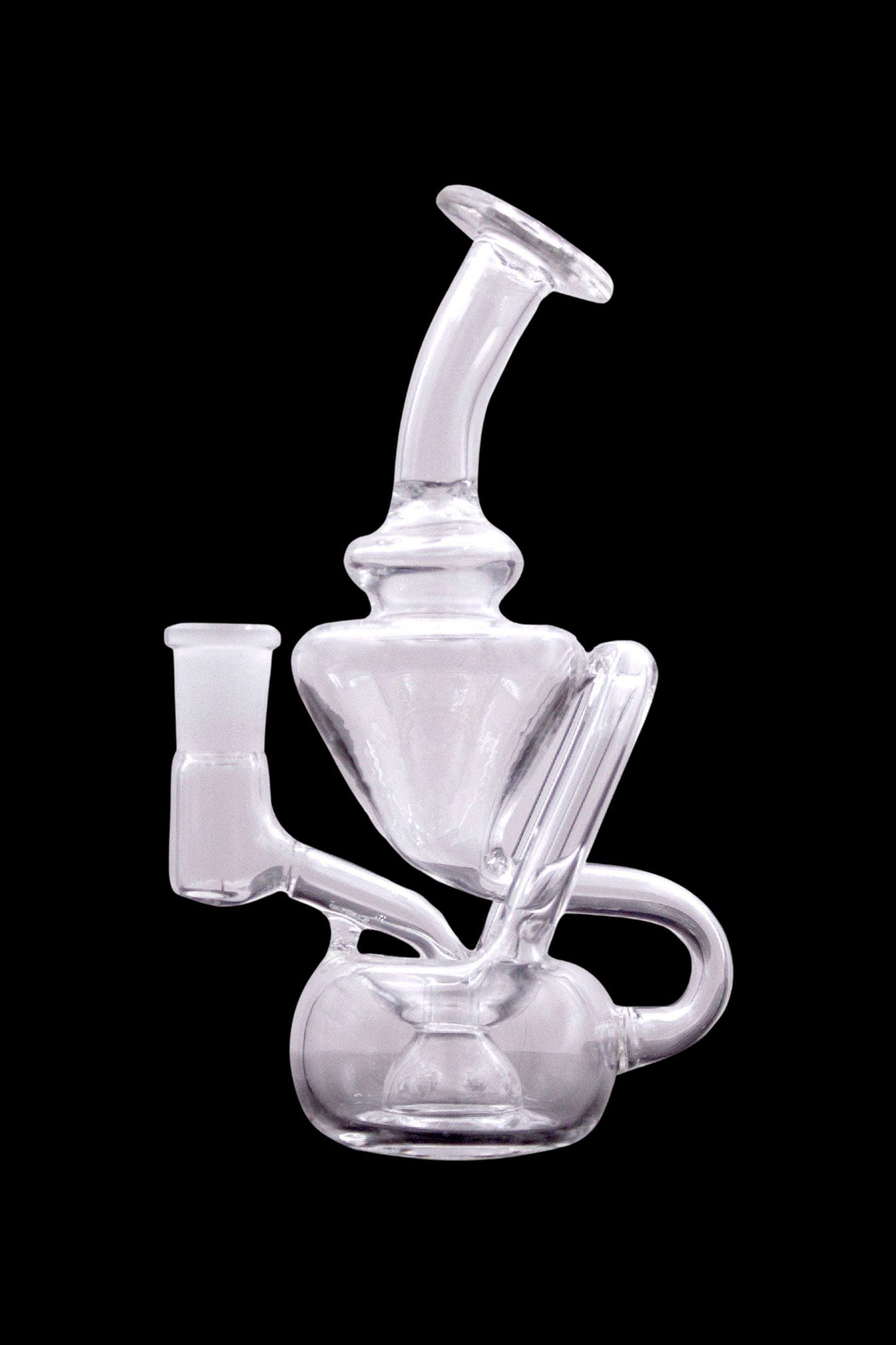 Clear glass dab rig with intricate bubbler design, isolated on a black background.