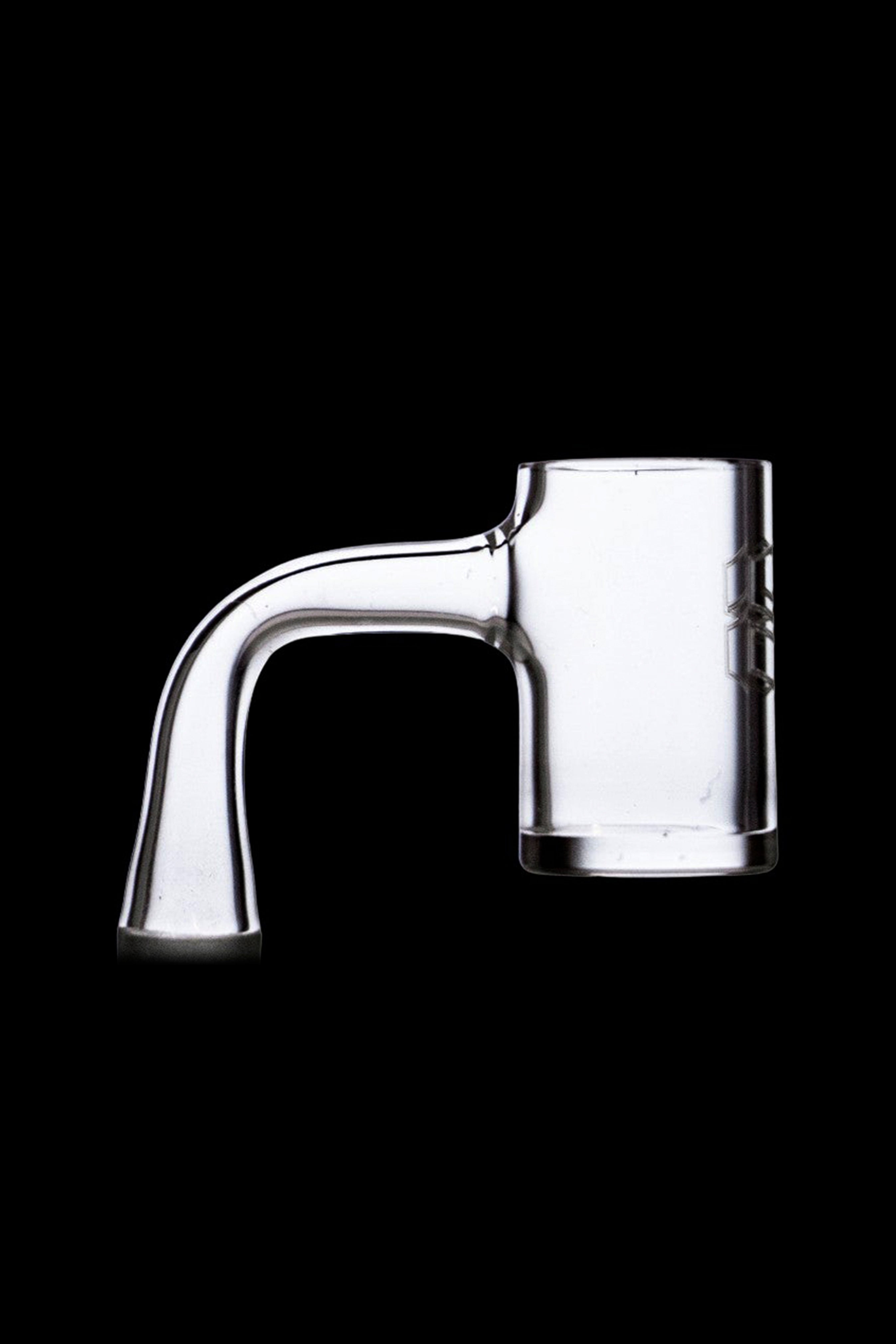 Clear quartz dab rig insert on black background.