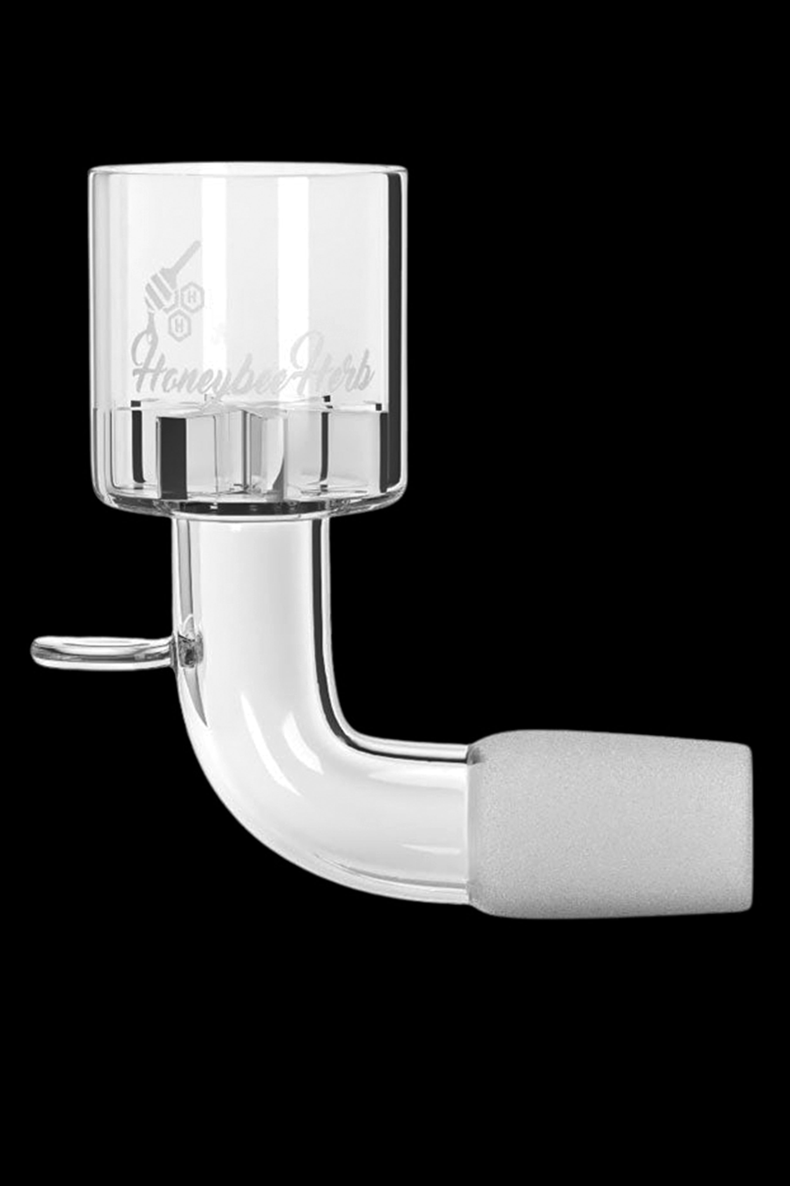 Clear quartz banger with a Honeycomb Carb cap for vaporizing cannabis concentrates.