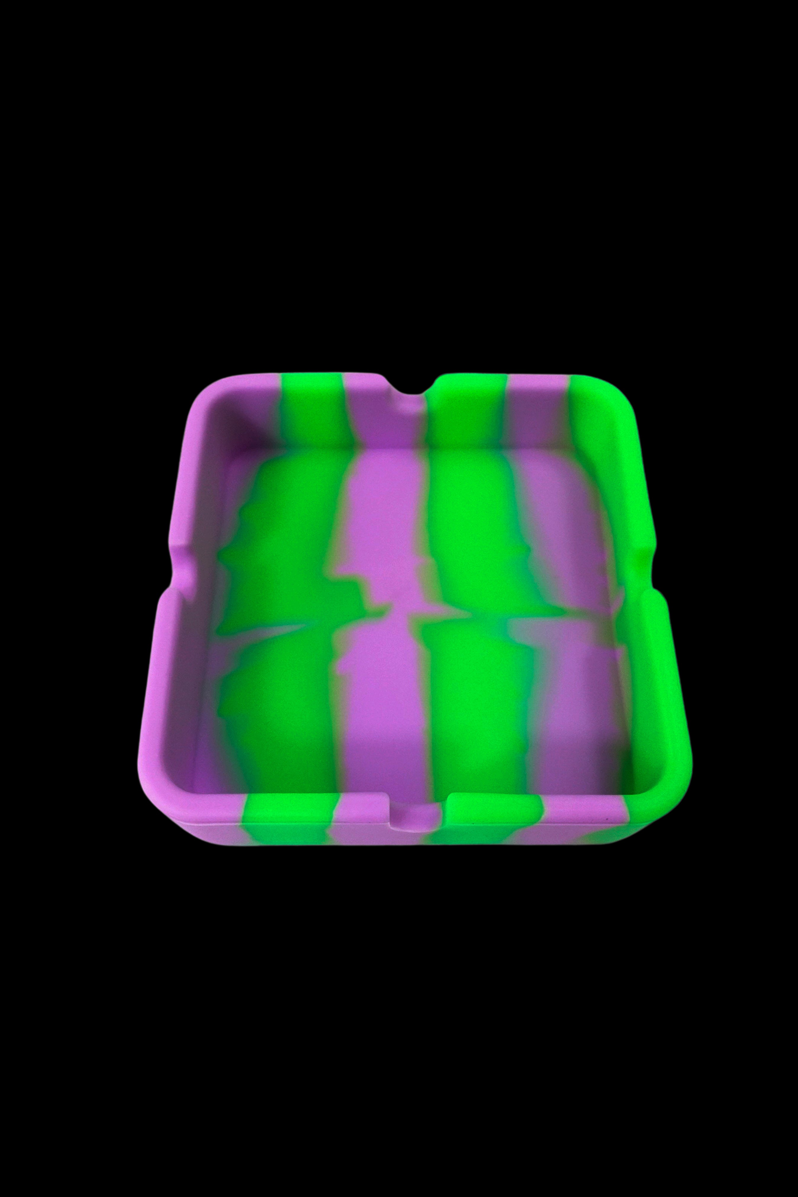 Purple and green silicone tray for cannabis accessories.