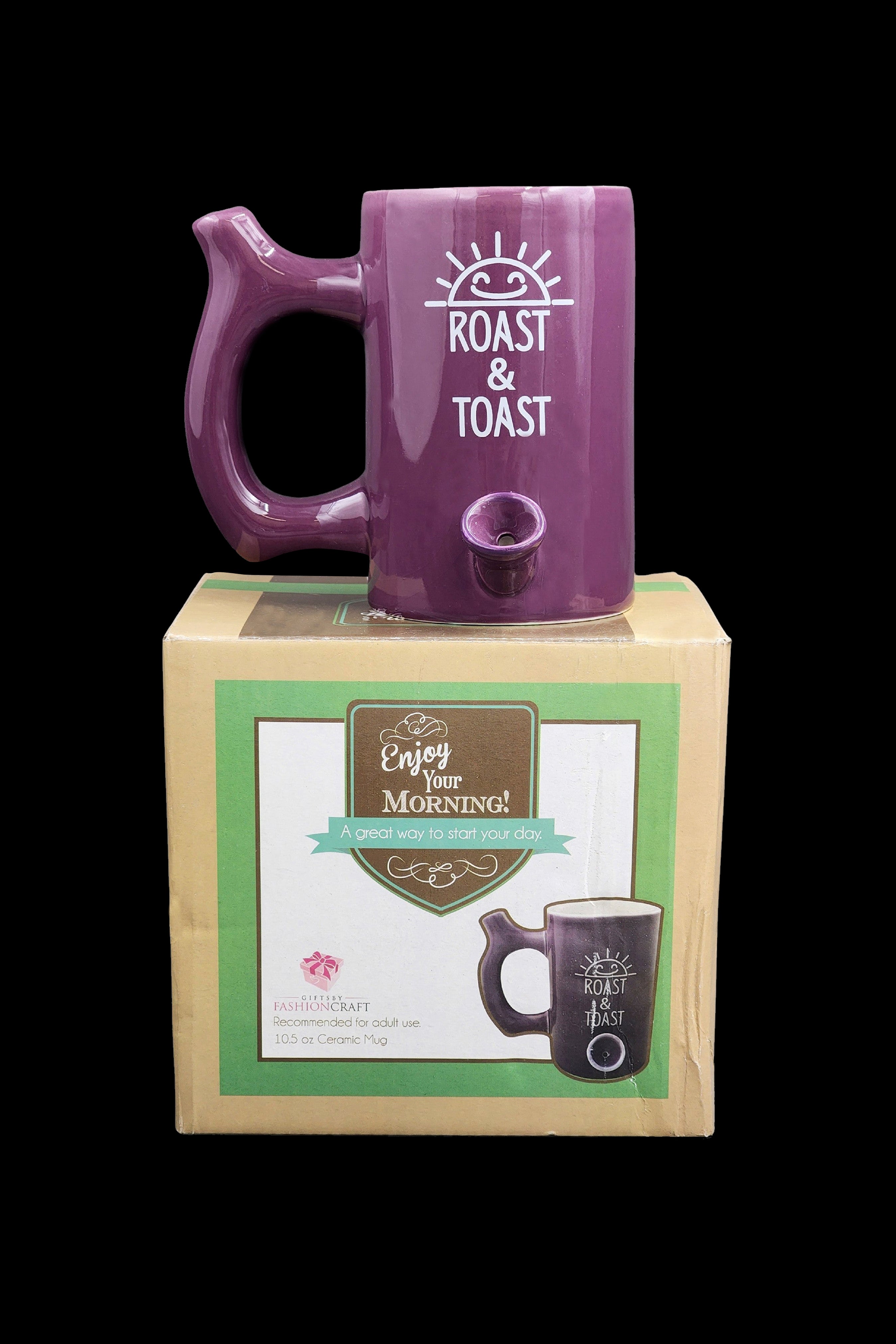 Purple ceramic mug with “Roast & Toast” lettering in a retail box, suggesting cannabis consumption accessory.