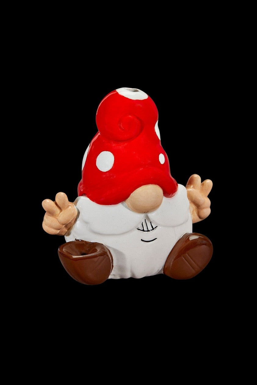 Red and white spotted mushroom-shaped ceramic piece, likely a cannabis accessory.