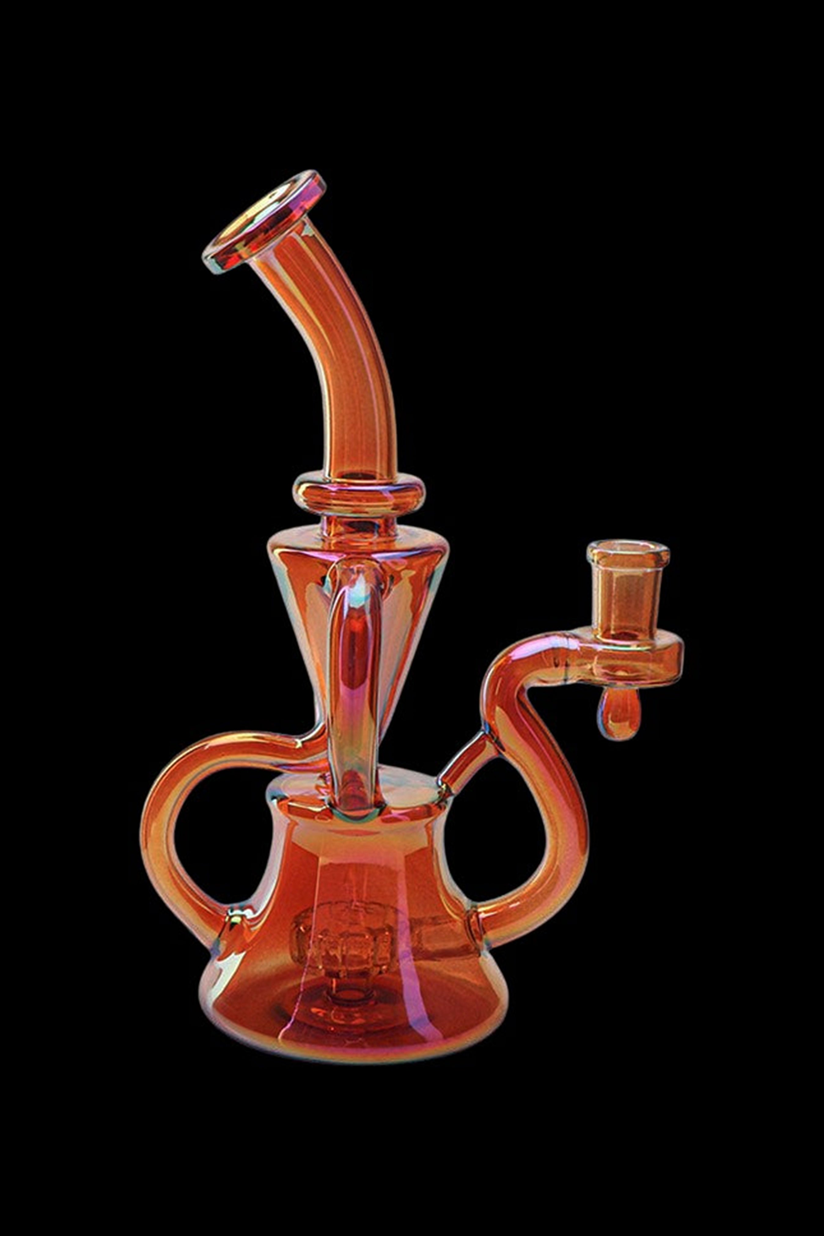 Orange glass water pipe (rig) with intricate curves and a bowl, isolated on black.