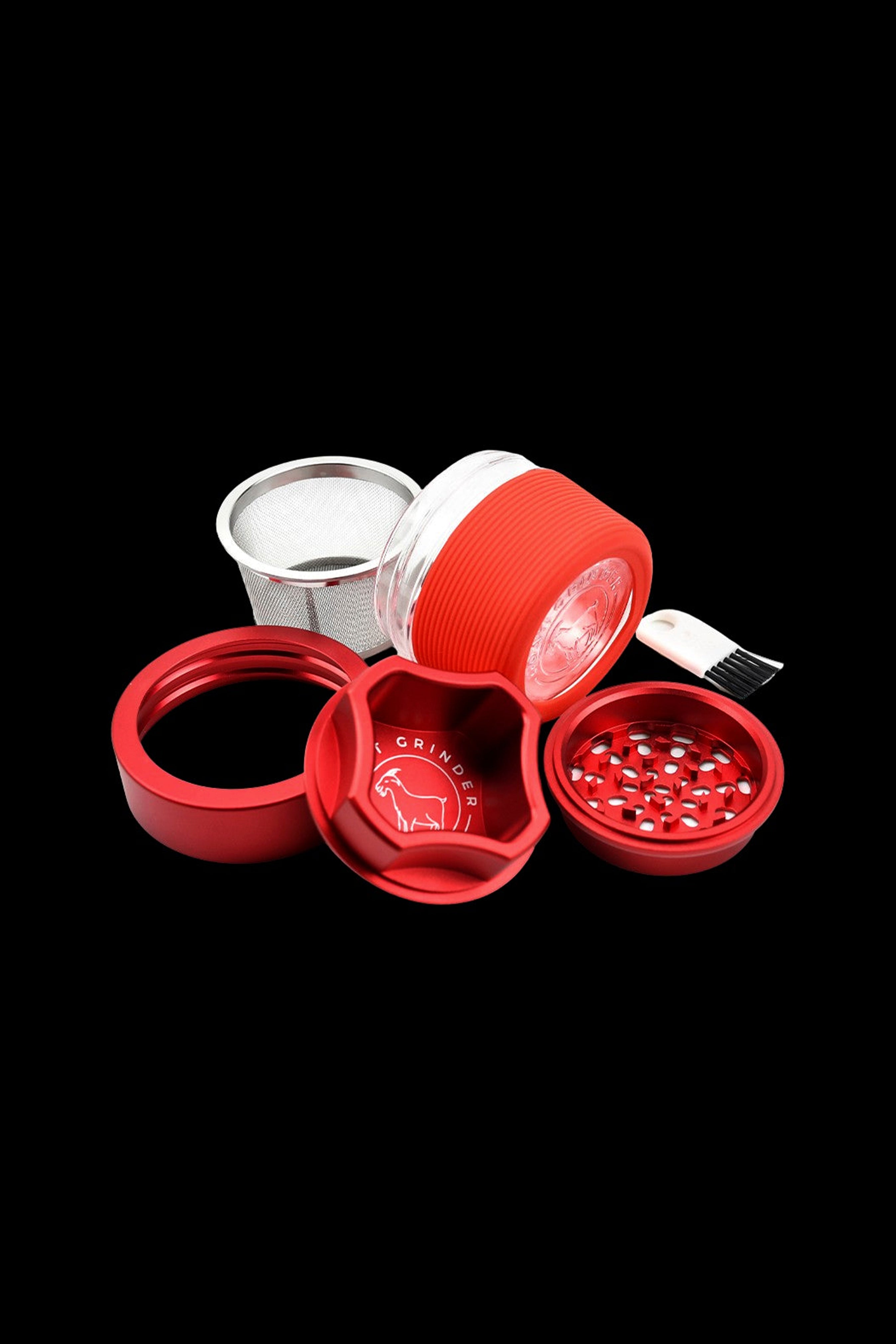 Red four-piece cannabis grinder with components disassembled and displayed on a black background.
