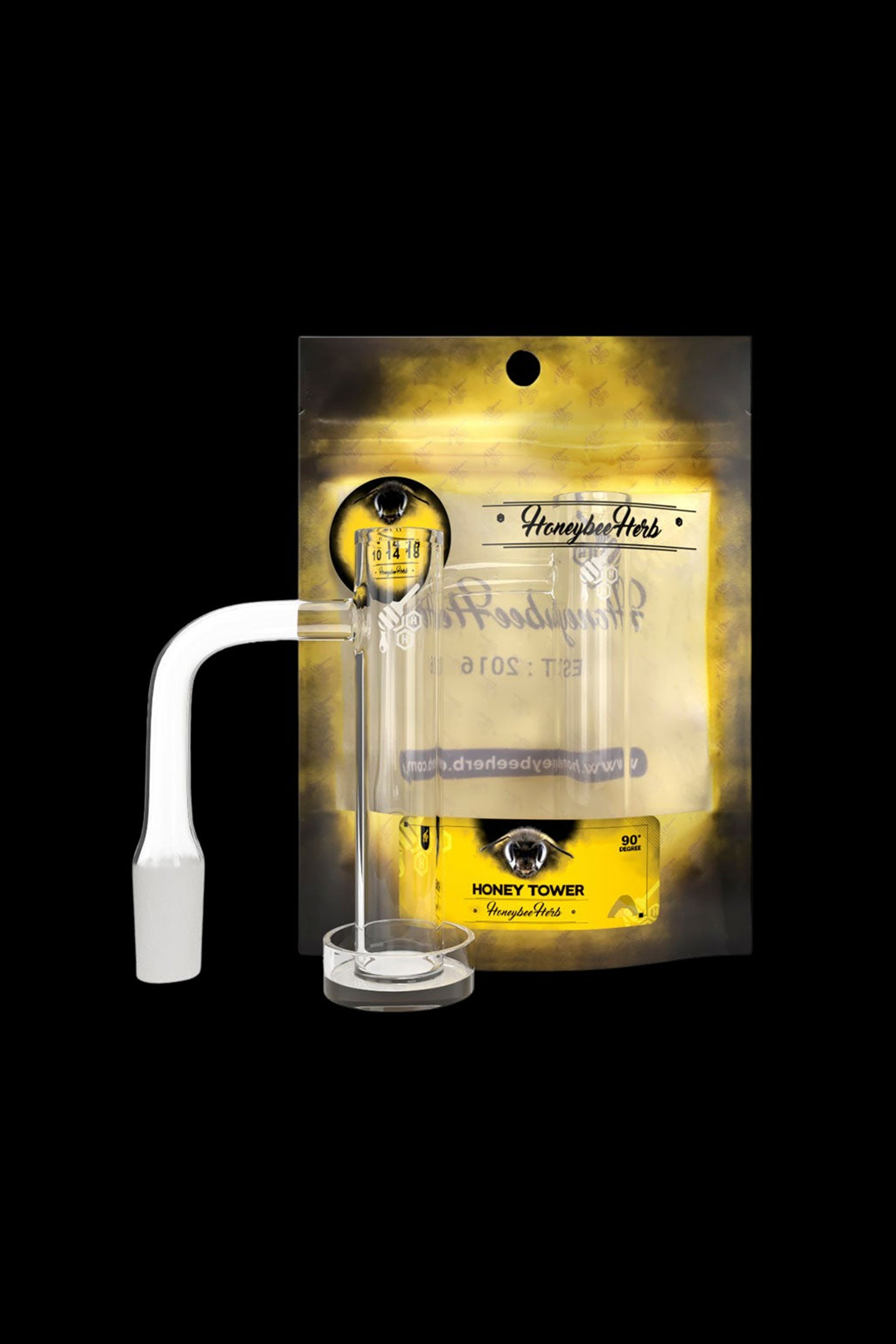 Clear glass dab rig with a honeycomb perc base, packaged on a gold card with “Honeybee Herb” branding."