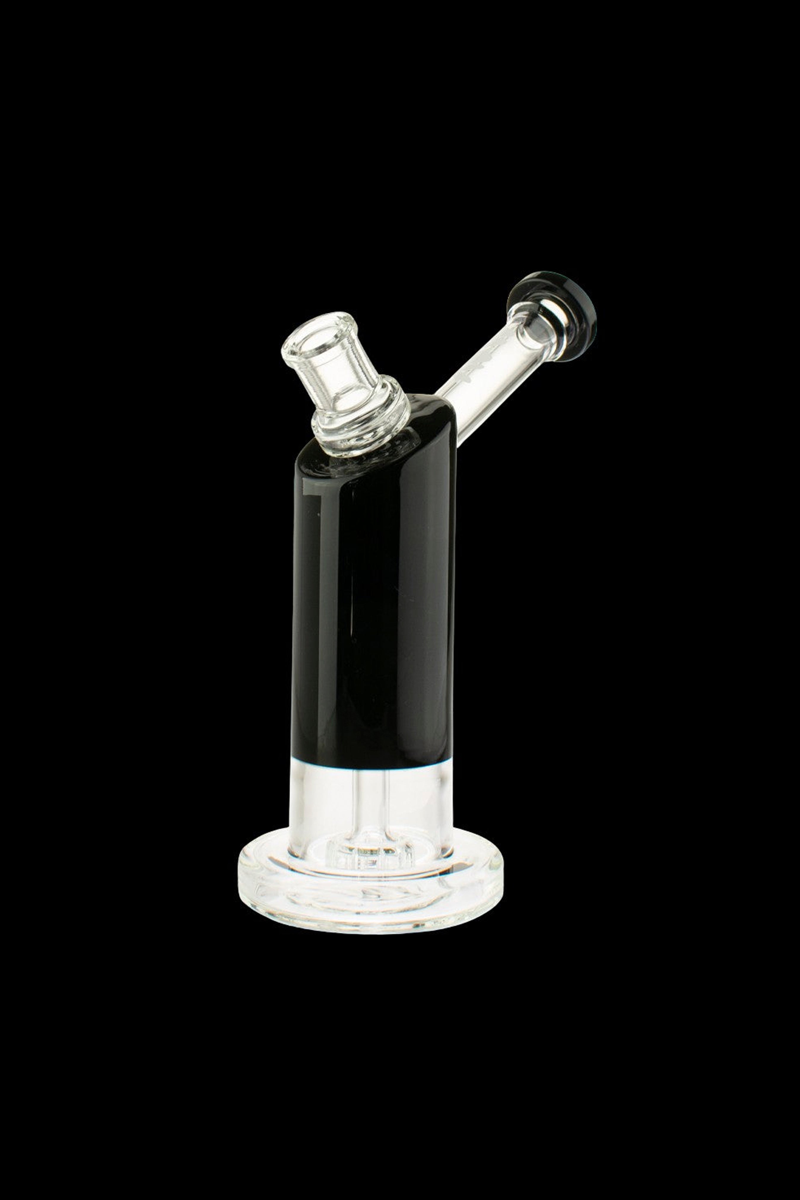 Black and clear glass rig for vaporizing concentrates, isolated on a black background.