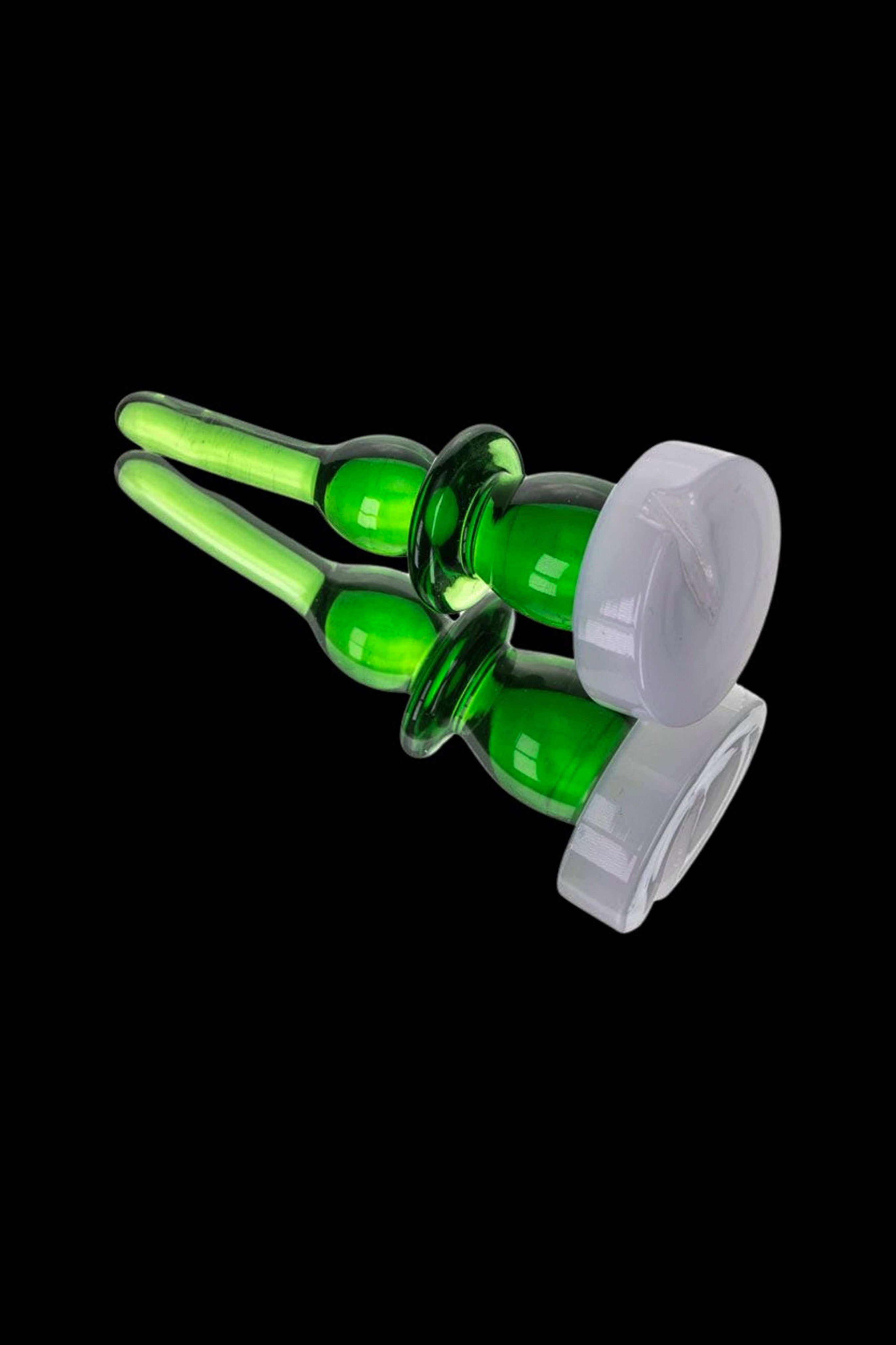 Green glass cannabis oil rig with clear glass carb cap.