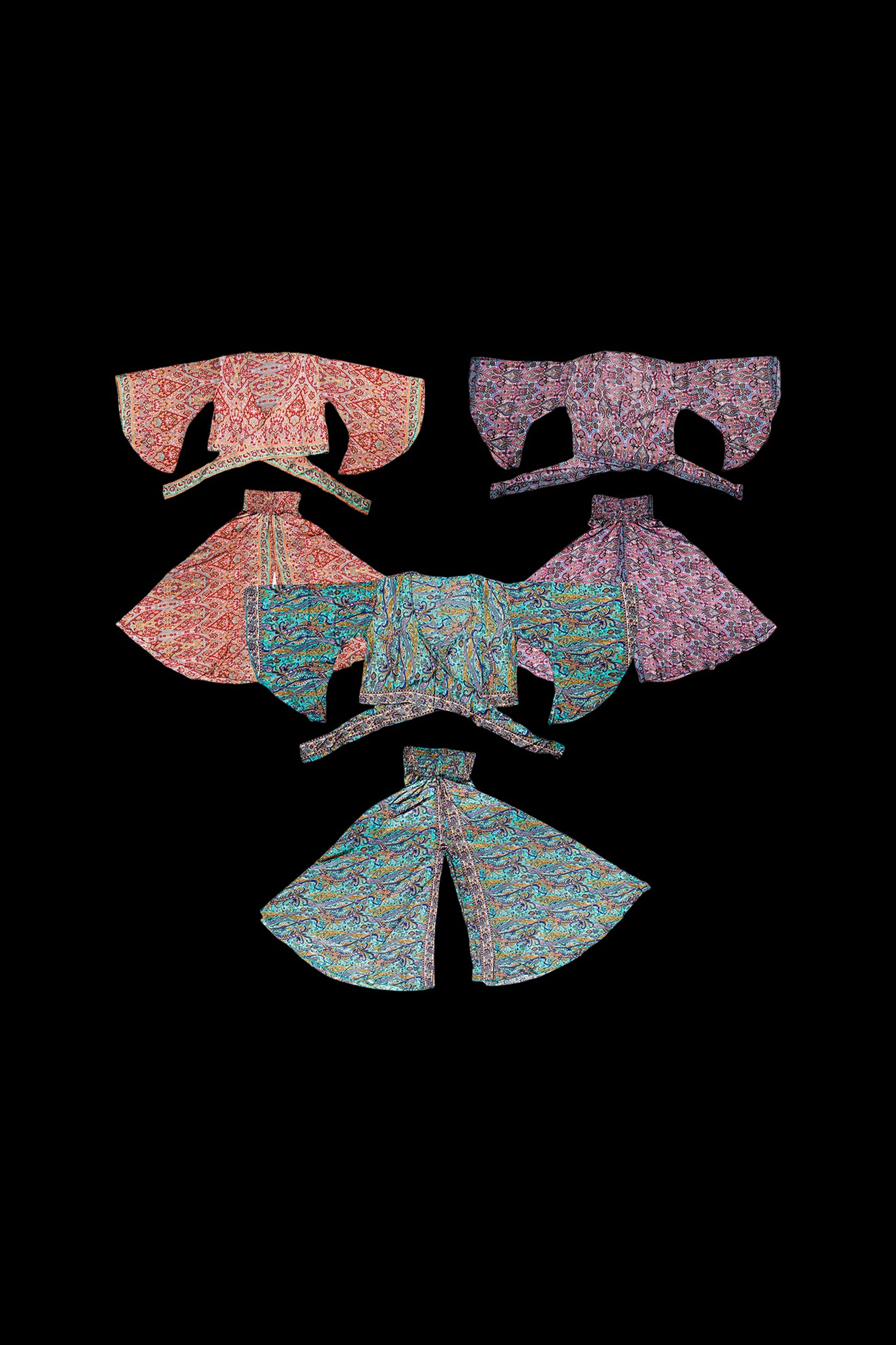 Abstract colorful illustration of cannabis rolling papers arranged in a symmetrical, floral-like pattern on a black background.