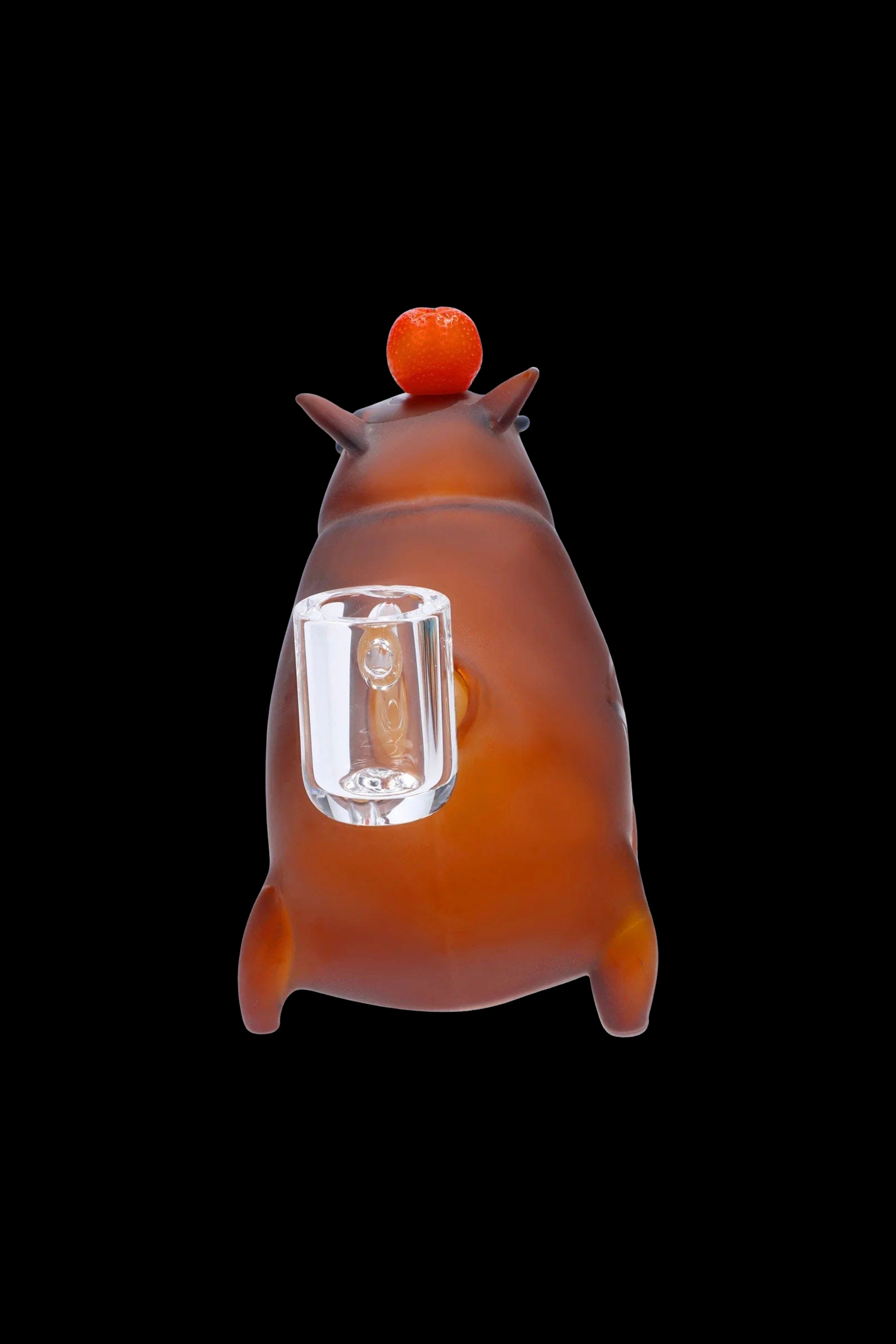 Orange glass rig with a clear glass insert, studio shot on a black background.