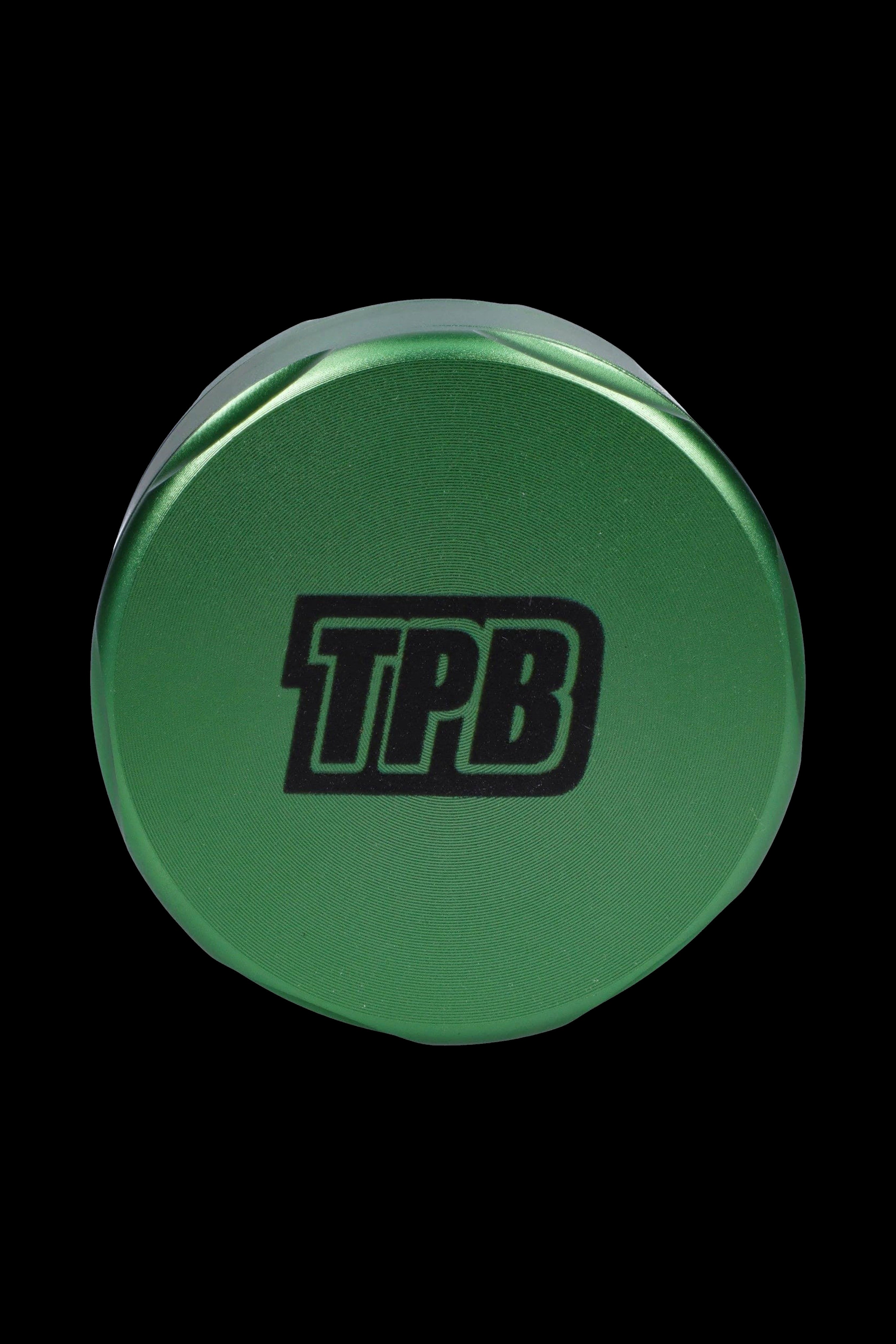 Green cannabis grinder with "TPB" logo.