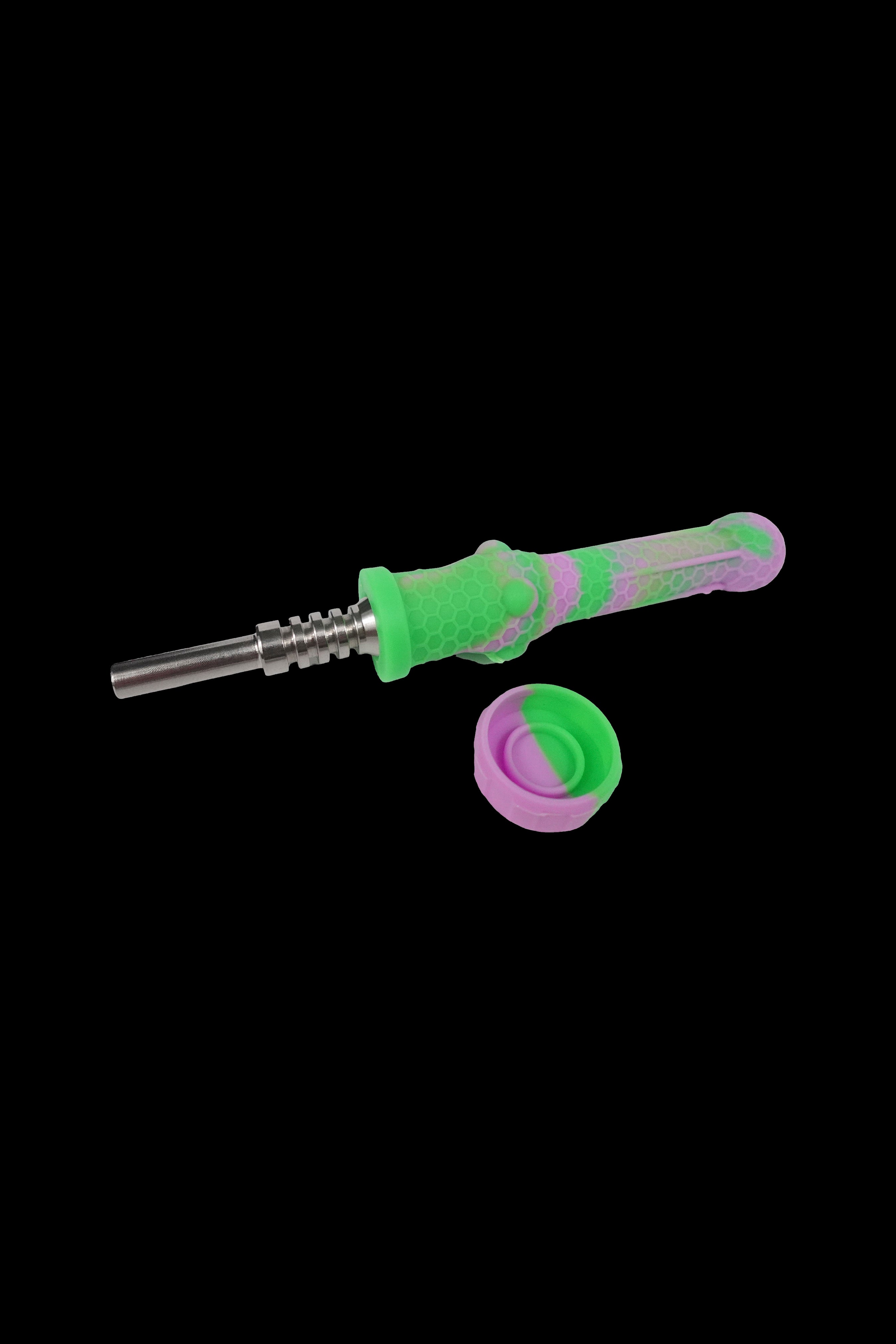 Pink and green silicone dab tool with a titanium tip, isolated on a black background.