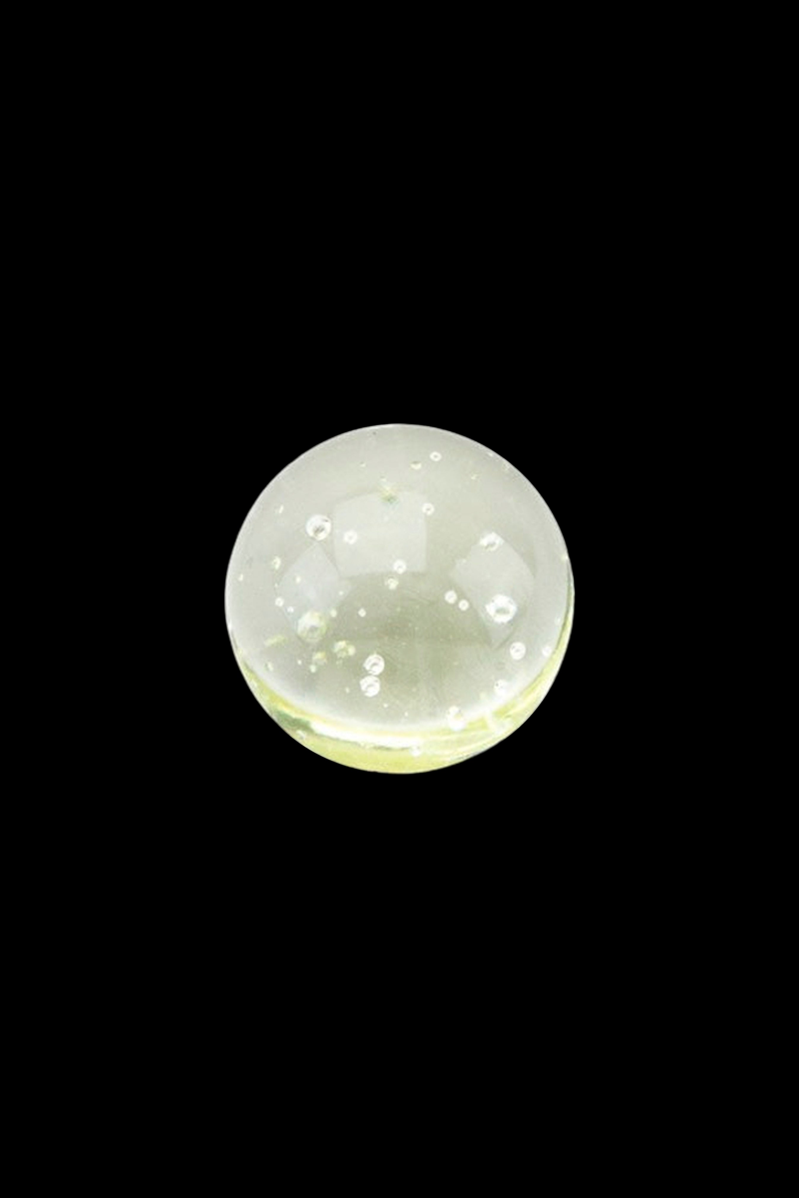 Close-up of green cannabis concentrate oil with bubbles.