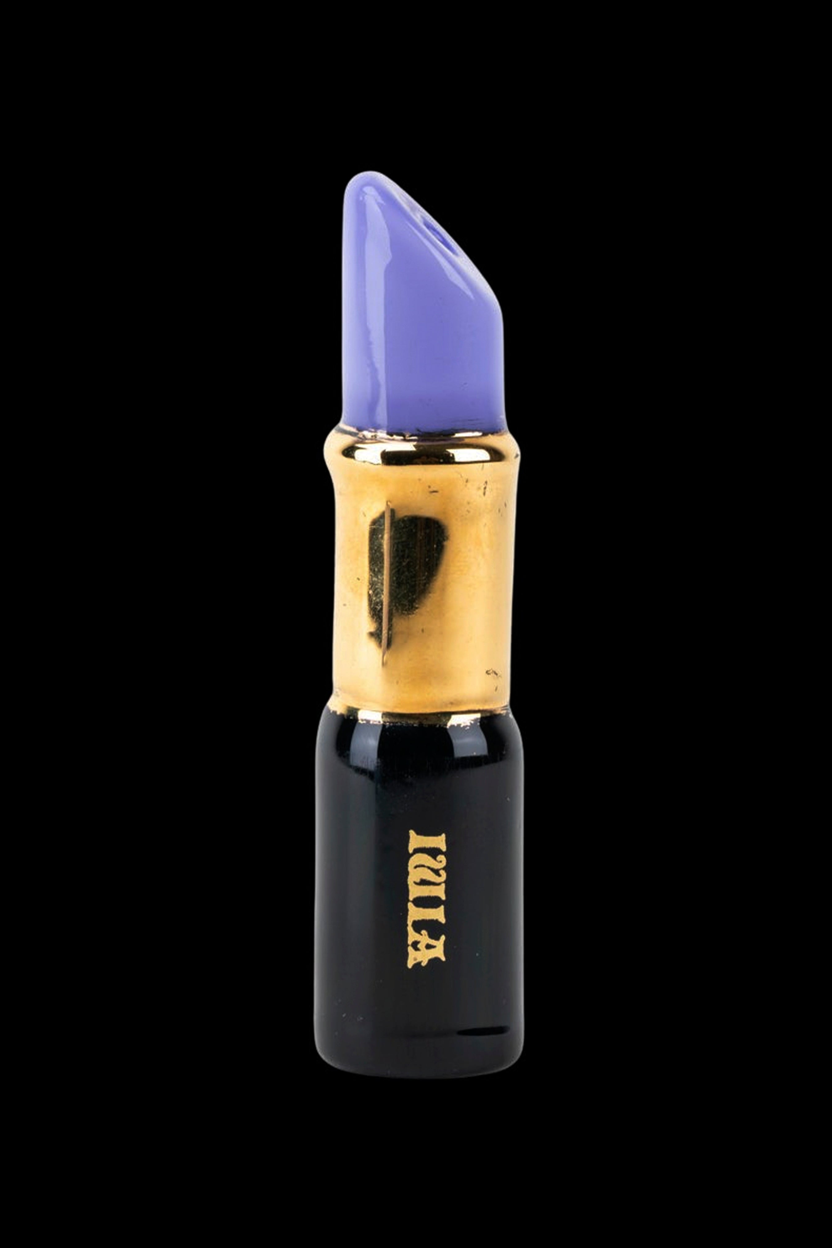 Purple cannabis dab oil applicator resembling lipstick on a black background.