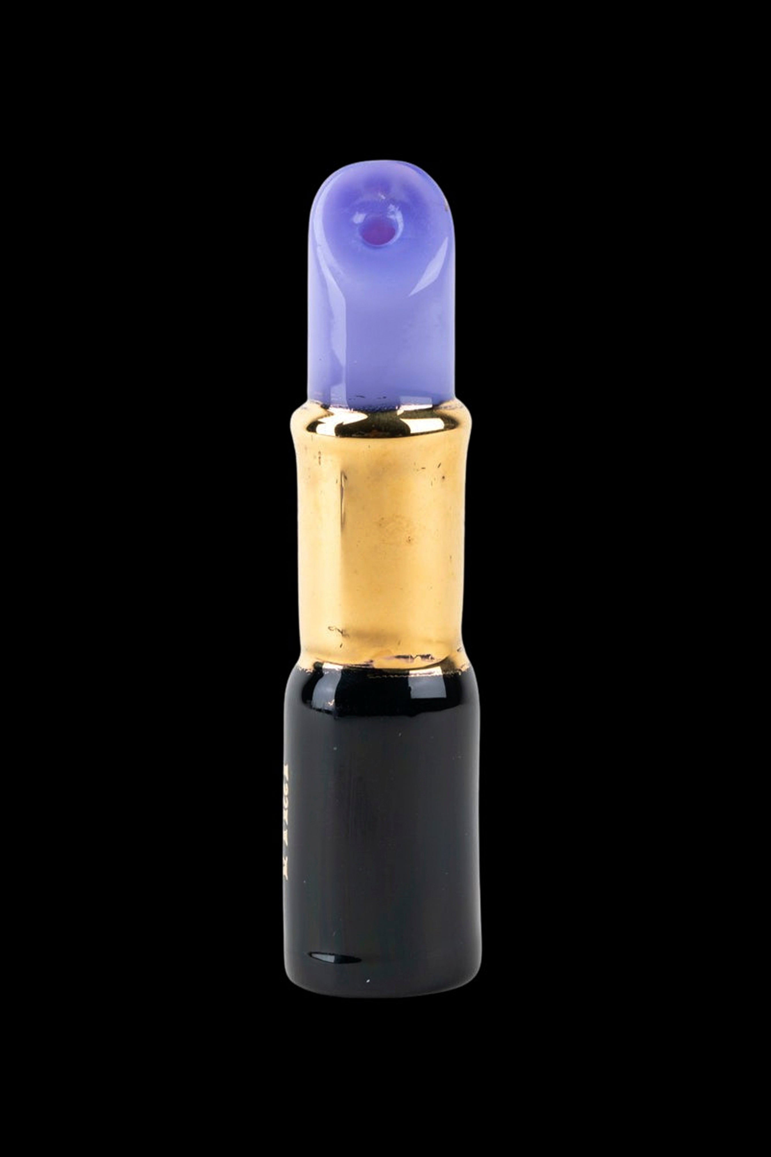 Glass cannabis oil burner pipe with blue mouthpiece and gold accents.