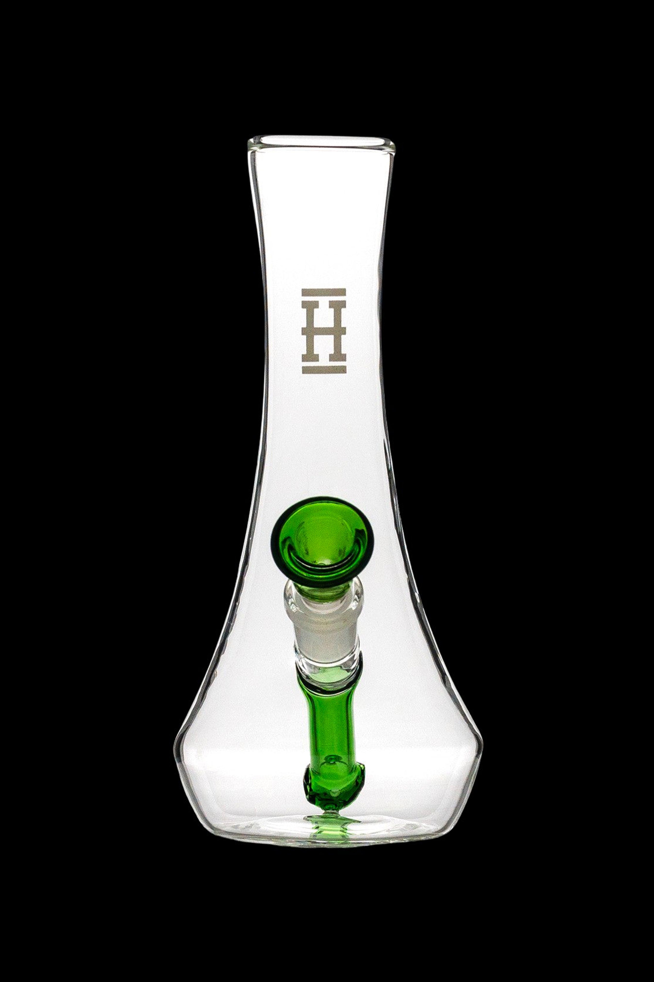 Clear glass water pipe with green accents and a branded logo.