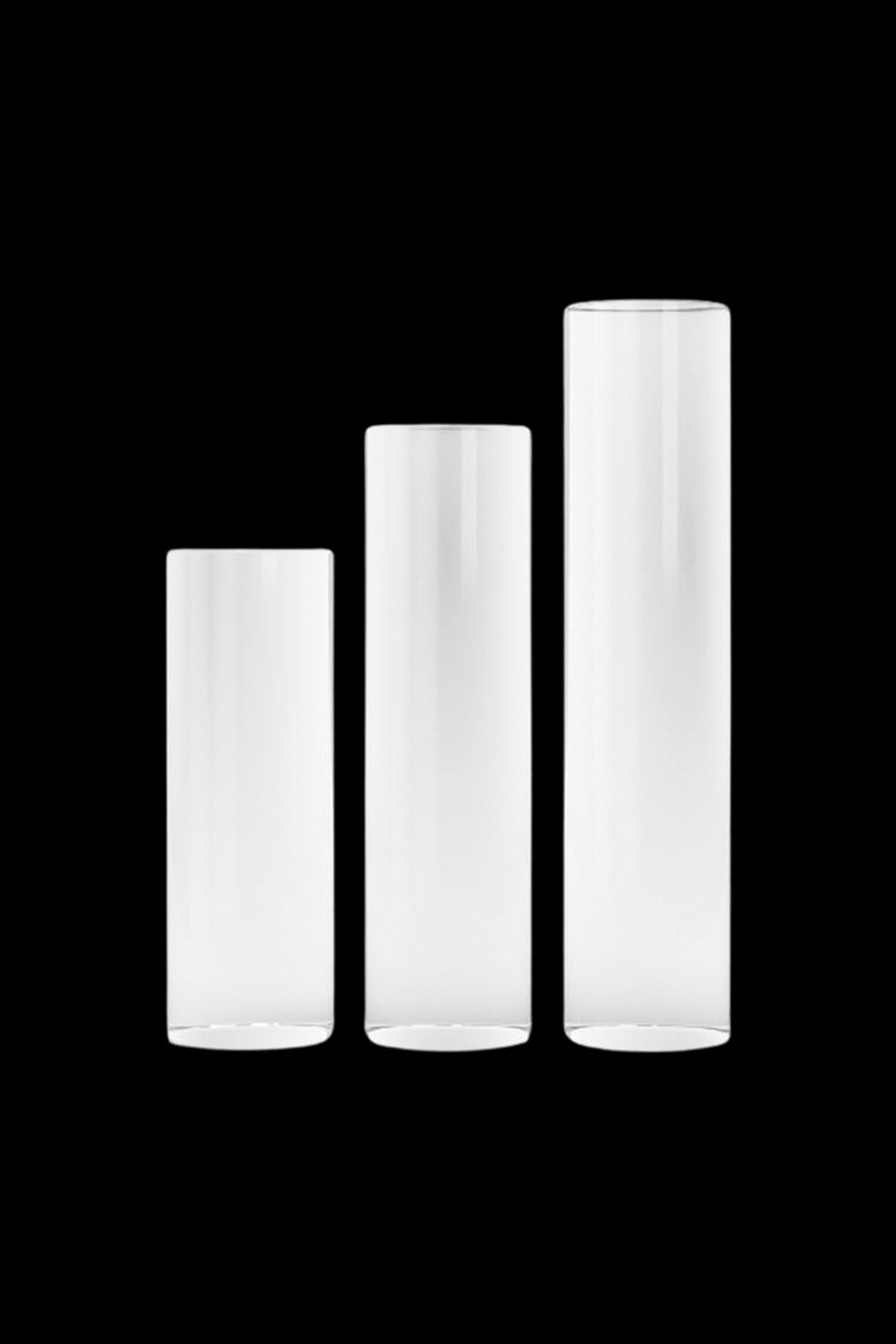 Four clear glass tubes, progressively taller, likely for use as bongs or water pipes.
