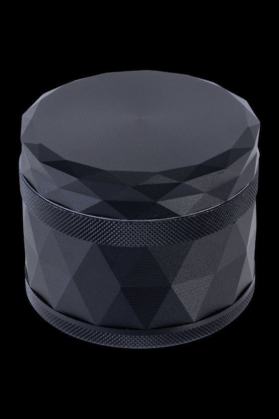 Black geometric cannabis grinder.