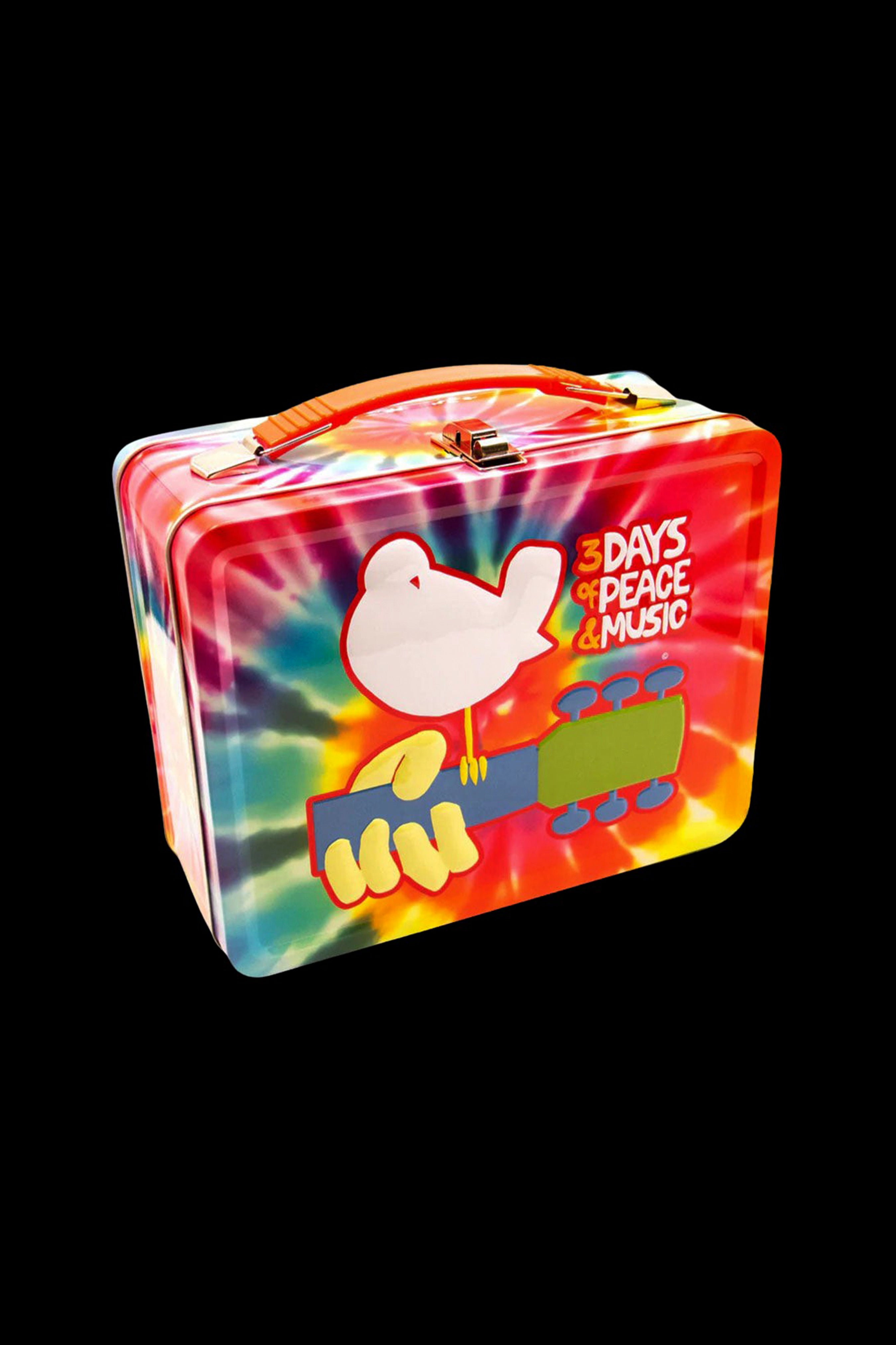 Tie-dye metal carrying case with peace dove and cannabis leaf design.