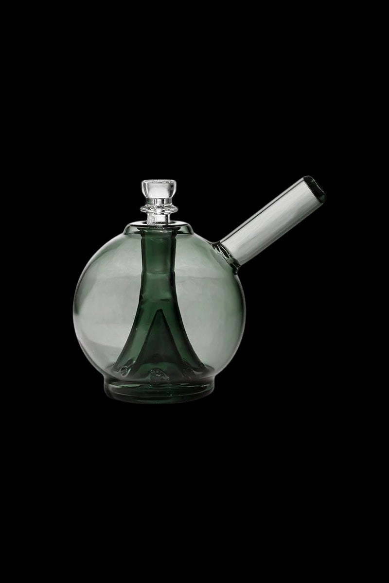 Green glass bubbler water pipe against a black background.