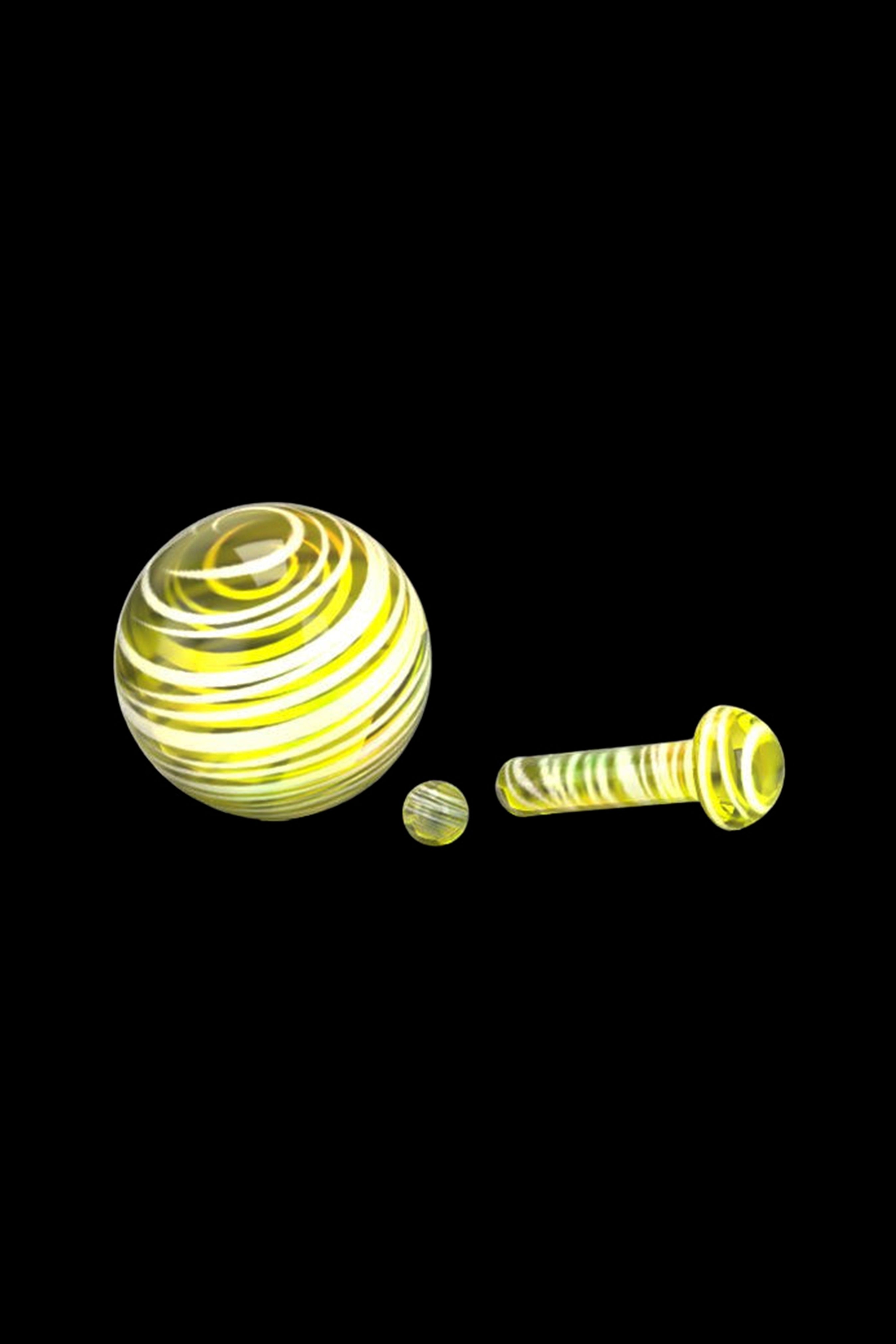 Yellow glass marbles and a cylindrical glass piece, likely components for a dab rig or water pipe.