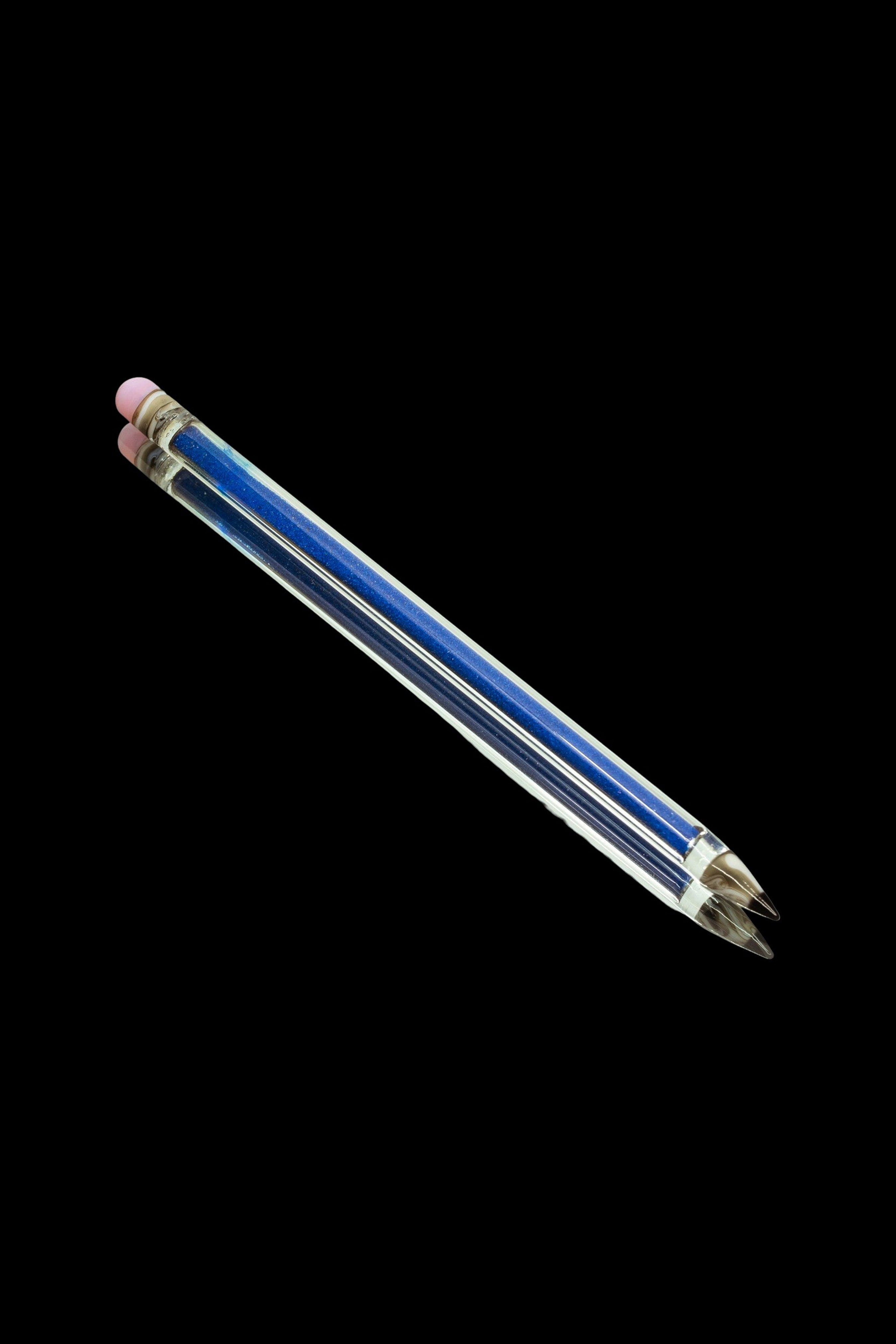 Glitter-filled glass dab straw with ceramic tip.