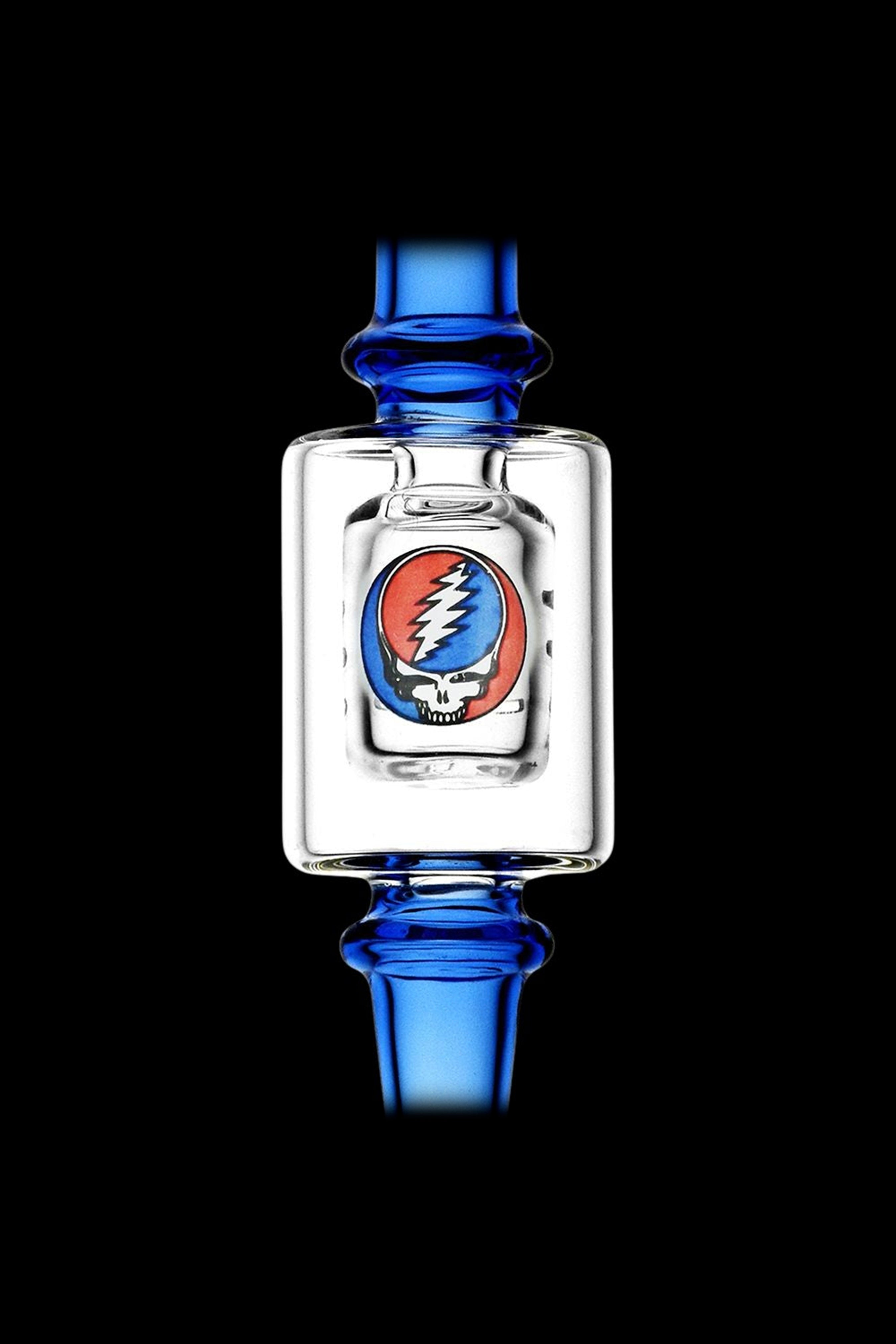 Blue glass cannabis water pipe featuring the iconic Grateful Dead “Steal Your Face” skull logo encased in a clear glass chamber.