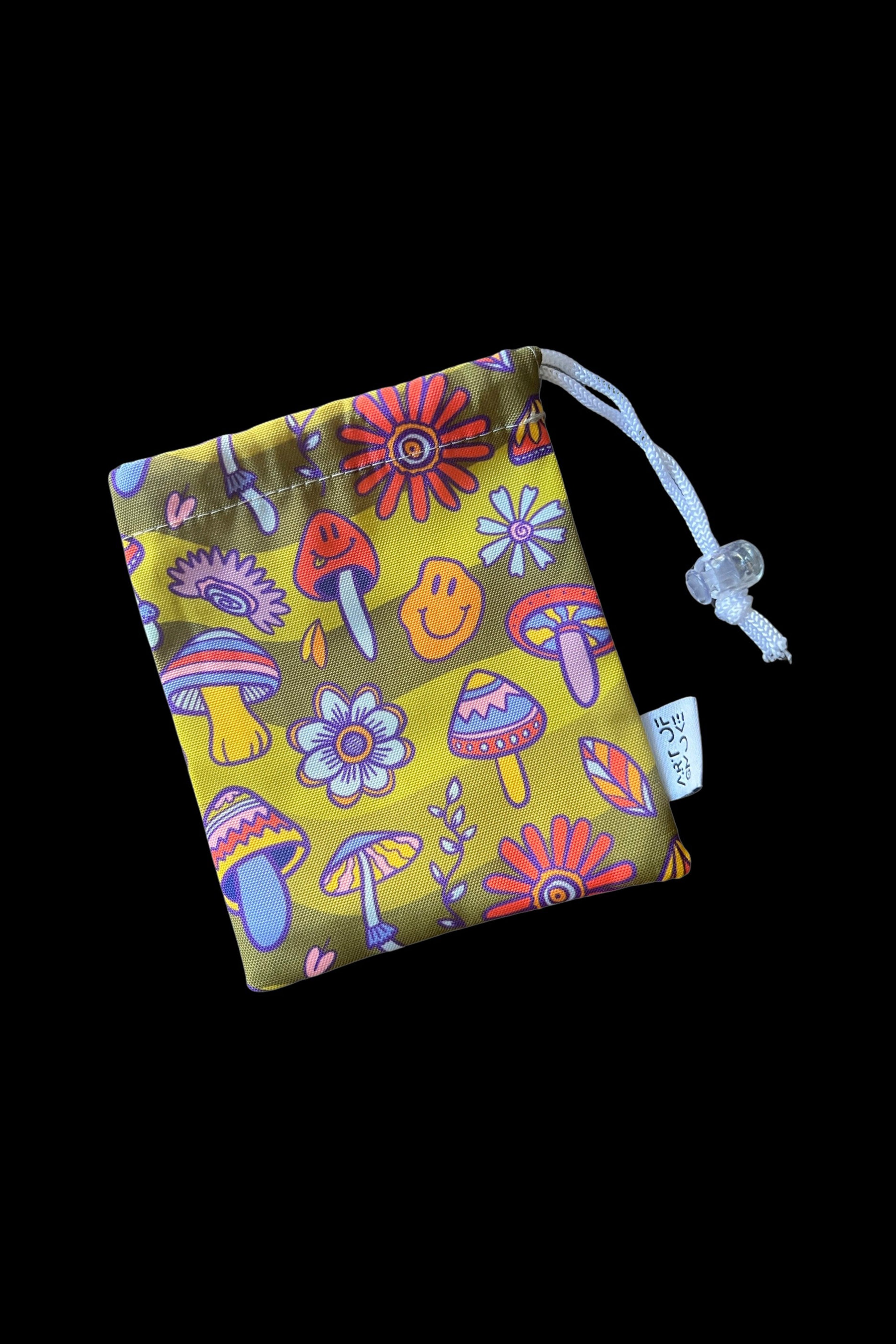 A drawstring bag with a psychedelic mushroom and floral pattern, likely used to store cannabis accessories.