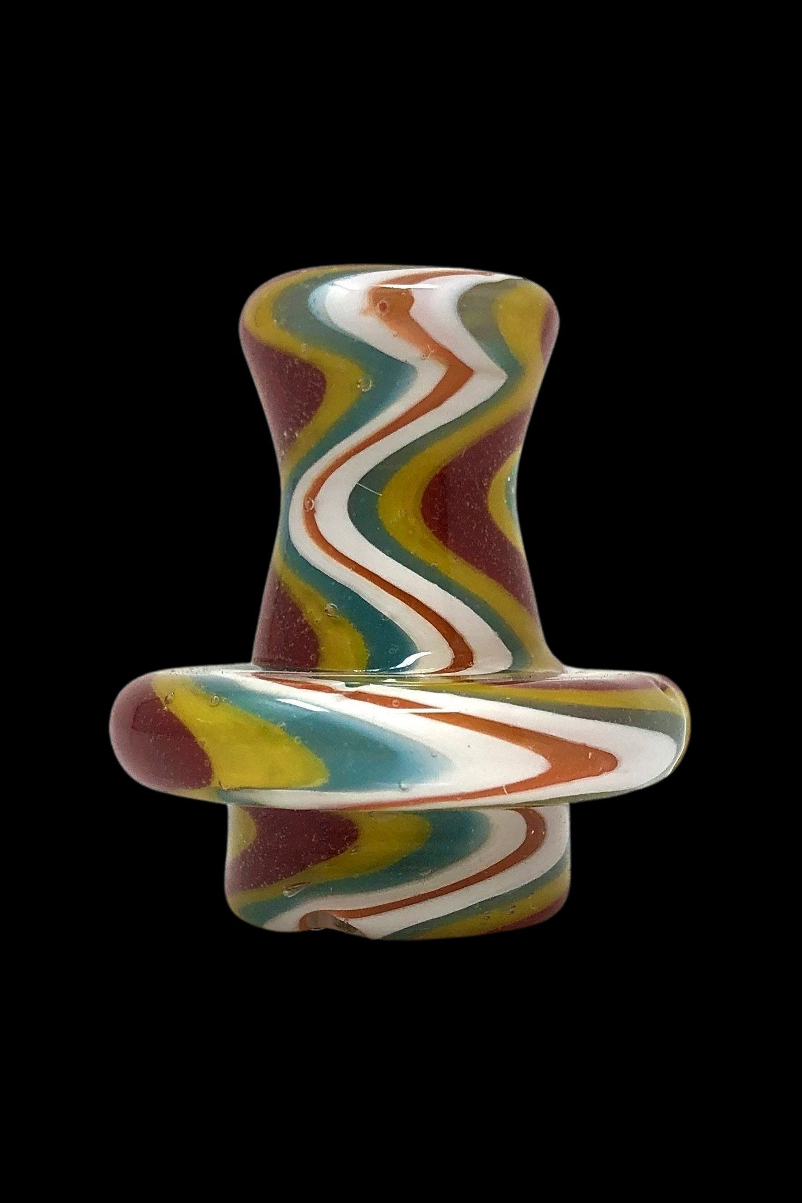 Hand-blown glass cannabis oil dome with colorful swirling patterns.