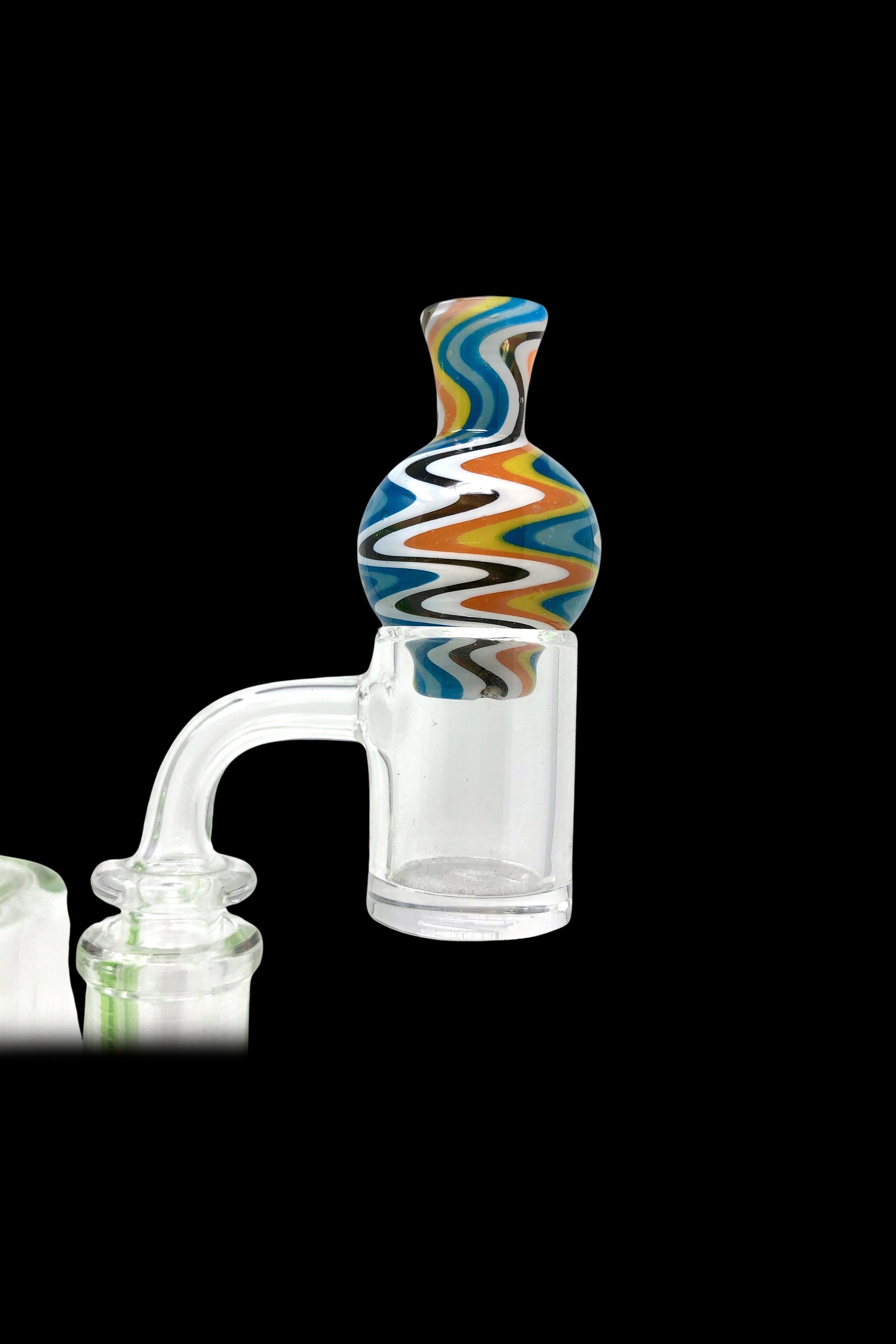 A glass dab rig attachment with colorful swirls on the cap, against a black background.