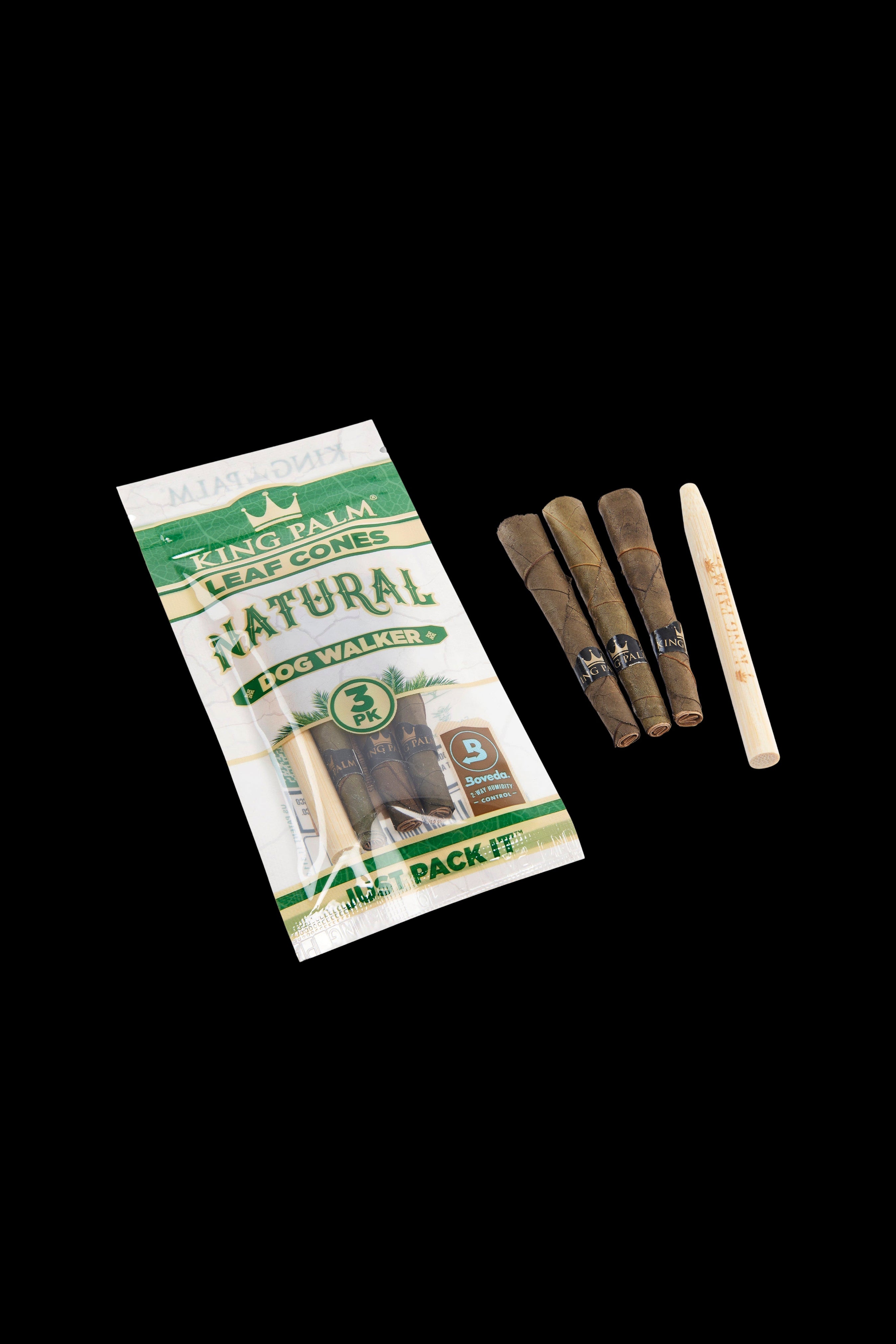 Package of King Palm Natural “Dog Walker” pre-rolled cones with three cones visible beside it, against a black background.