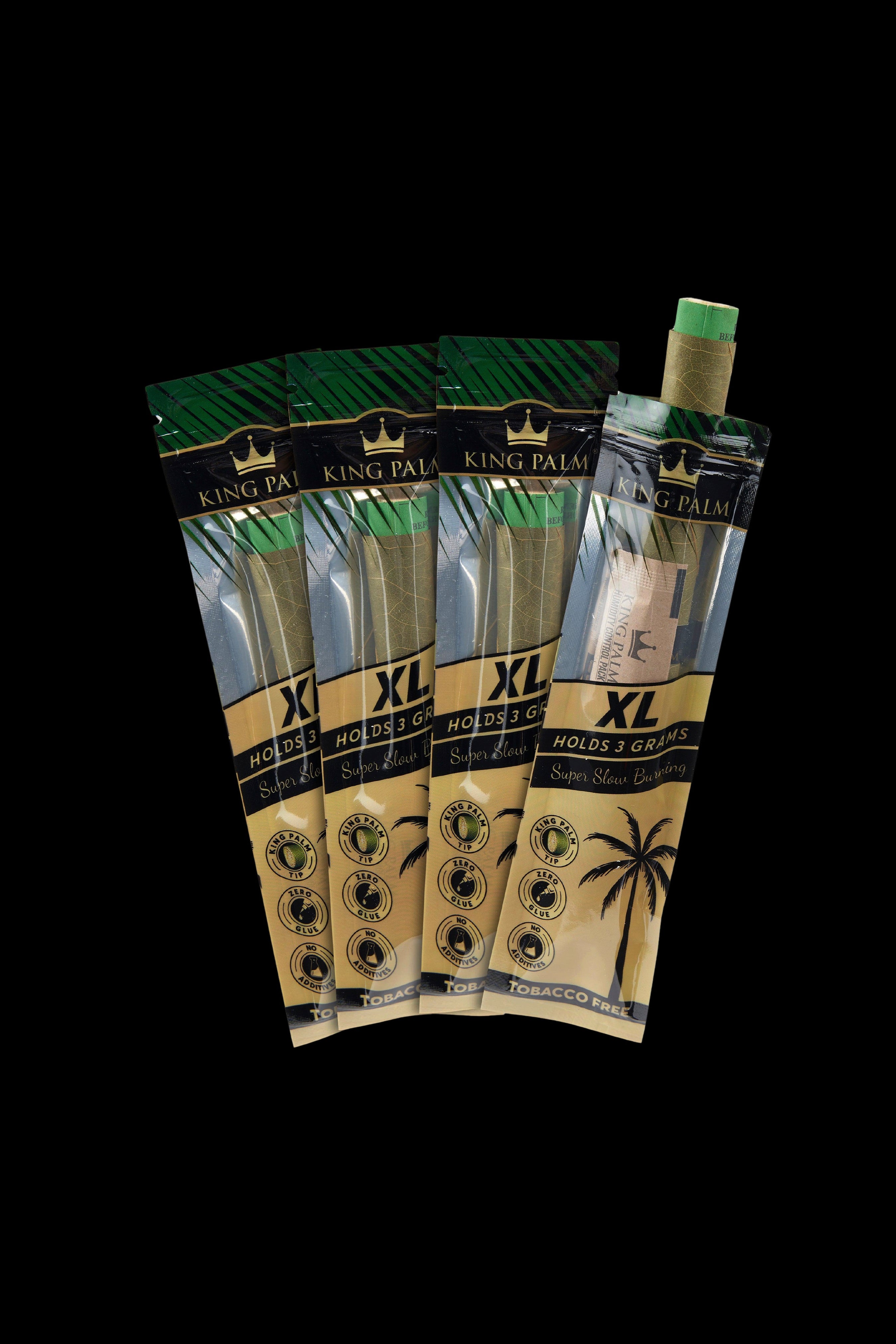 Four King Palm XL pre-rolled leaf wraps and a small container, displayed against a black background.