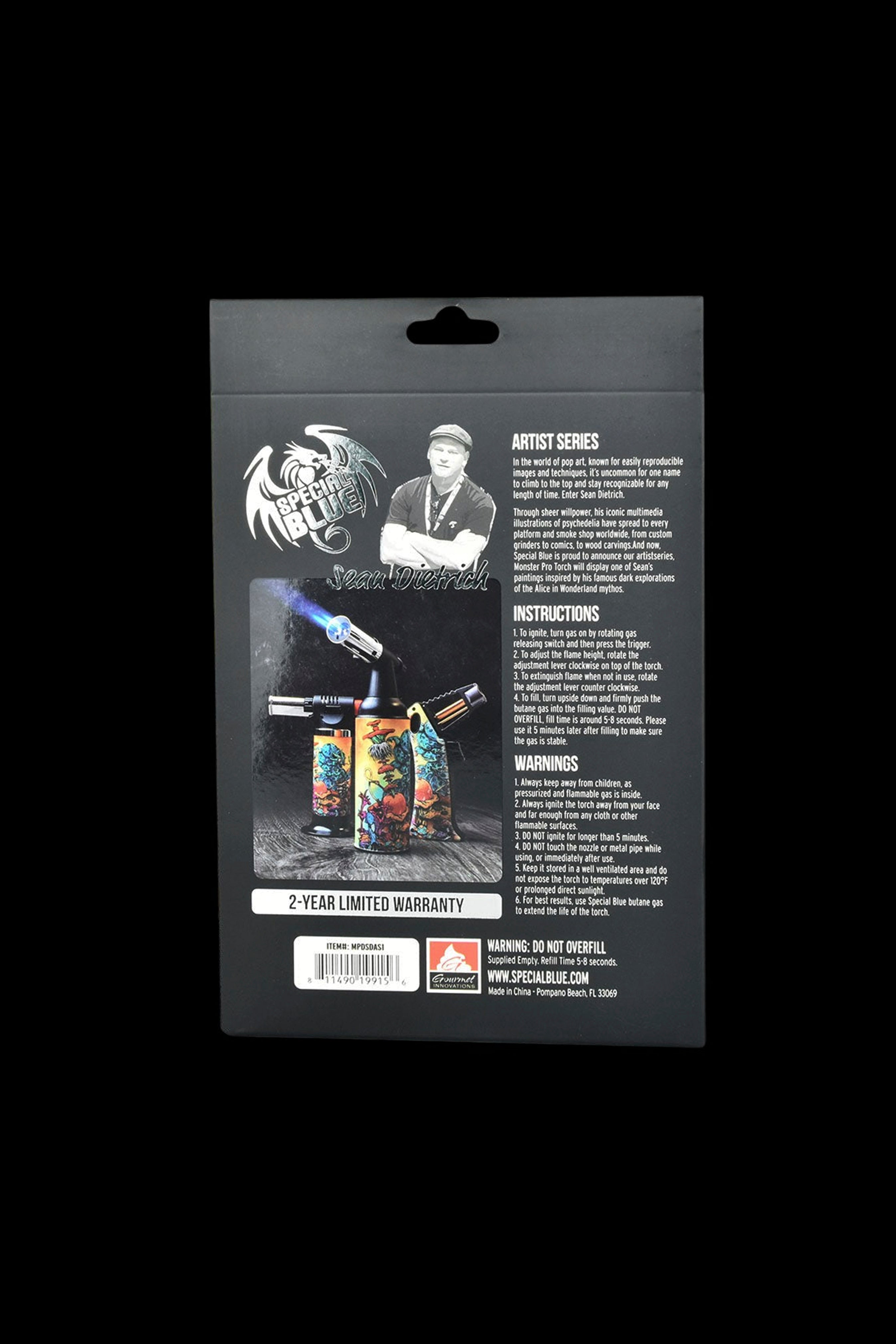 Product packaging for a Special Blue torch lighter, featuring artwork by Sean Desmond and including safety warnings and instructions.