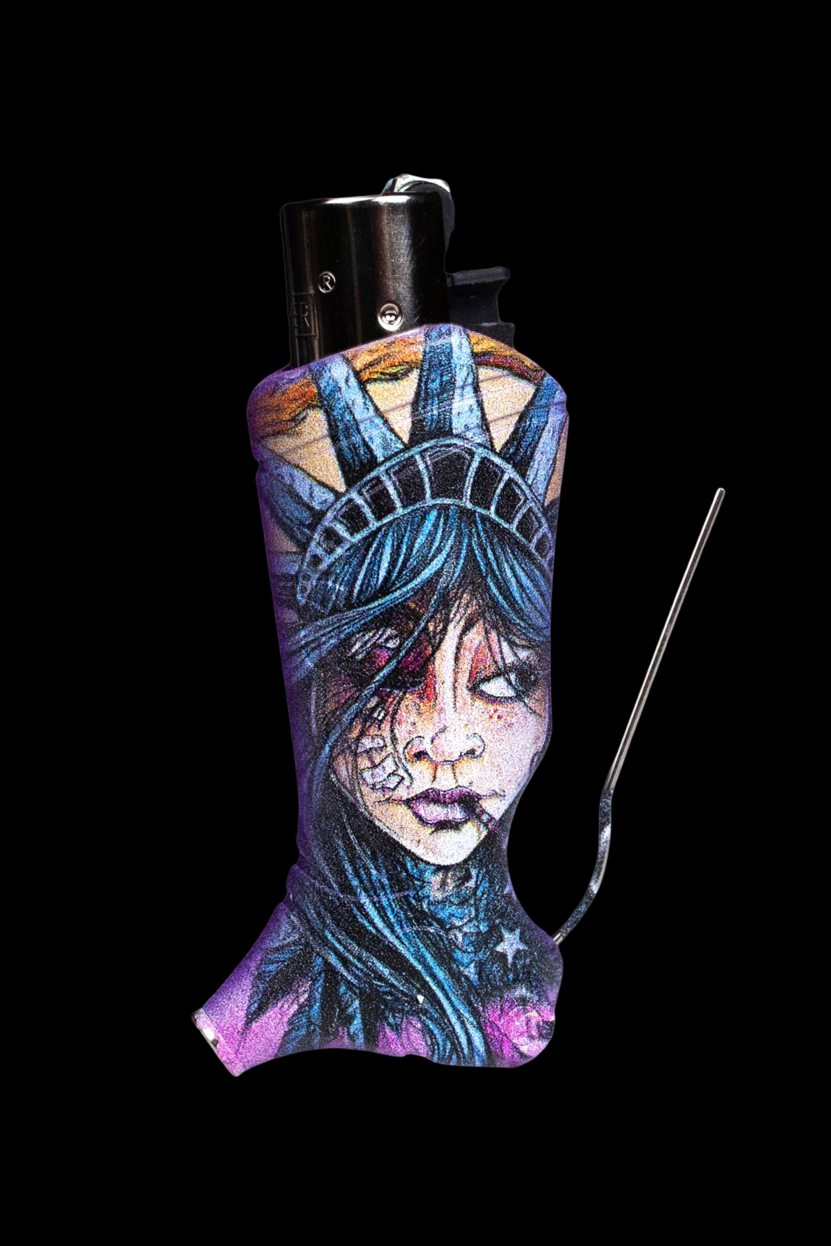 A lighter sleeve depicting a stylized, melancholic portrait of Lady Liberty, alongside a black lighter and metal tool, against a black background.