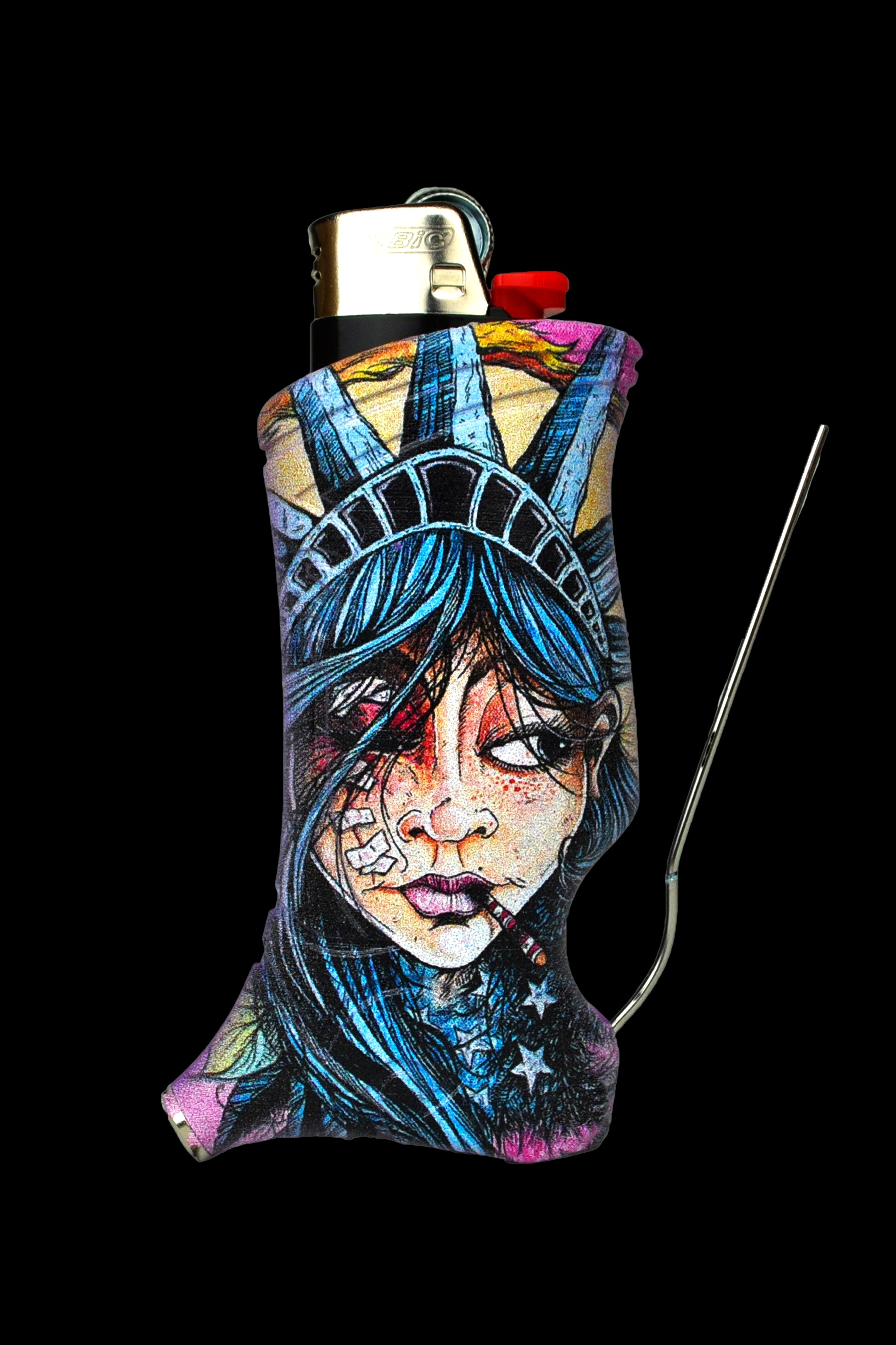 A lighter sleeve depicting a stylized, haunting portrait of Lady Liberty with cannabis leaves and stars, paired with a metal dab tool against a black background.