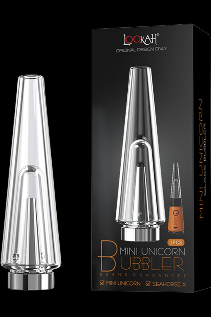 A clear glass bubbler water pipe for cannabis use, displayed with its packaging and accessories.