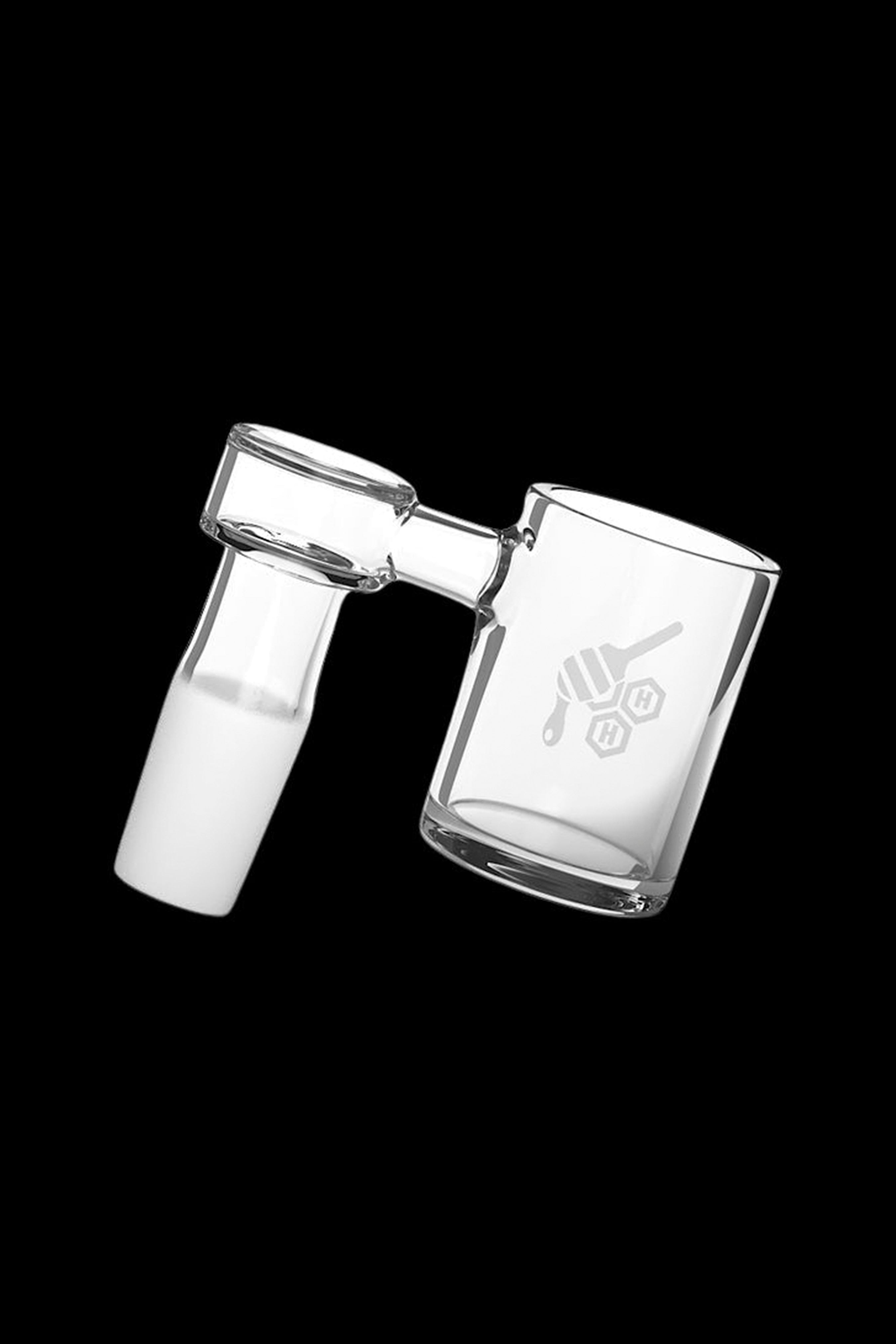 Clear glass dab rig with etched design, isolated on a black background."