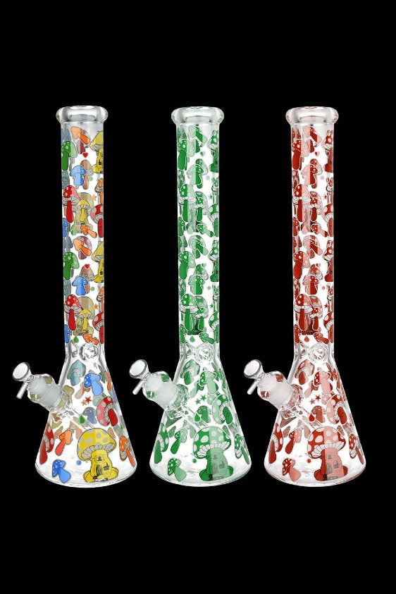 Three glass bongs with colorful mushroom designs against a black background.